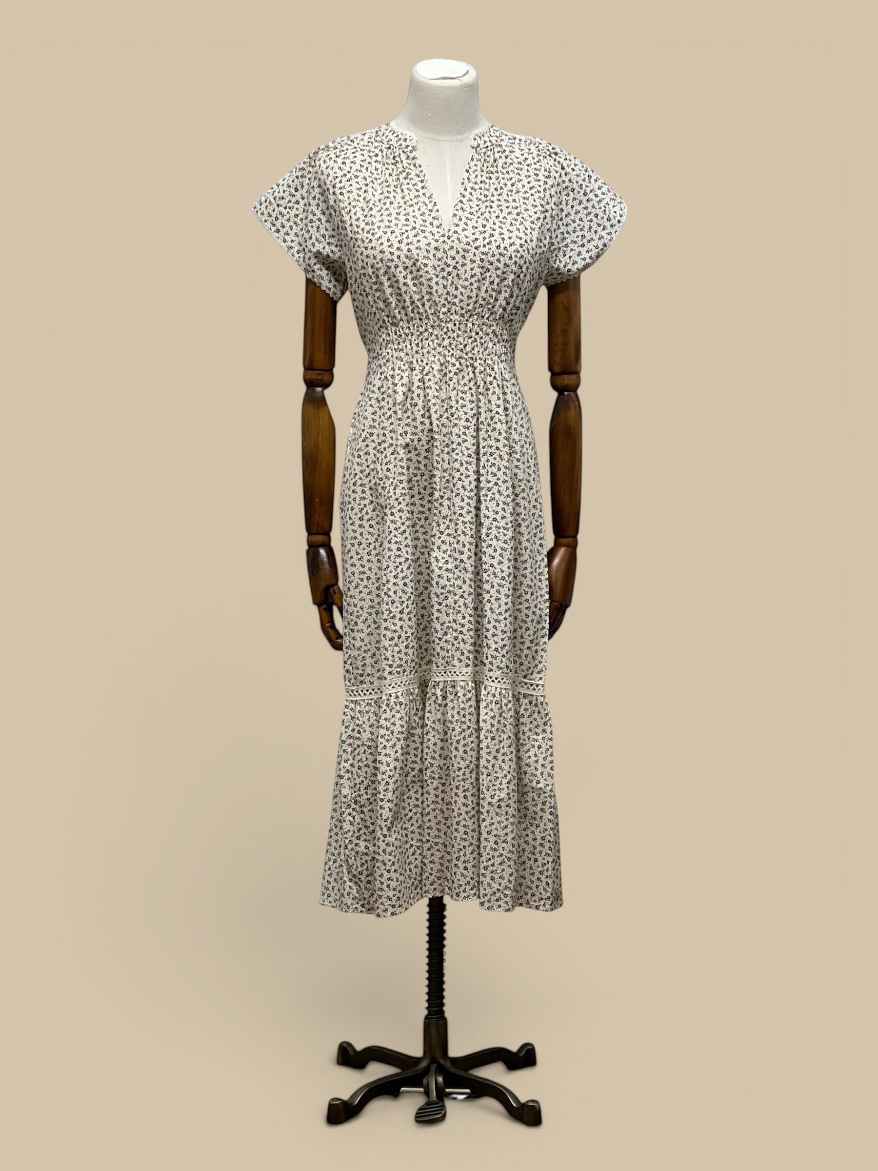 Homestyle Collective brown & ivory ditzy floral print cotton midi dress with smocked waist and scallop lace trim.
