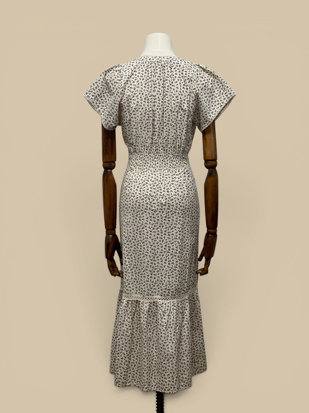 Homestyle Collective brown & ivory ditzy floral print cotton midi dress with smocked waist and lace trim.