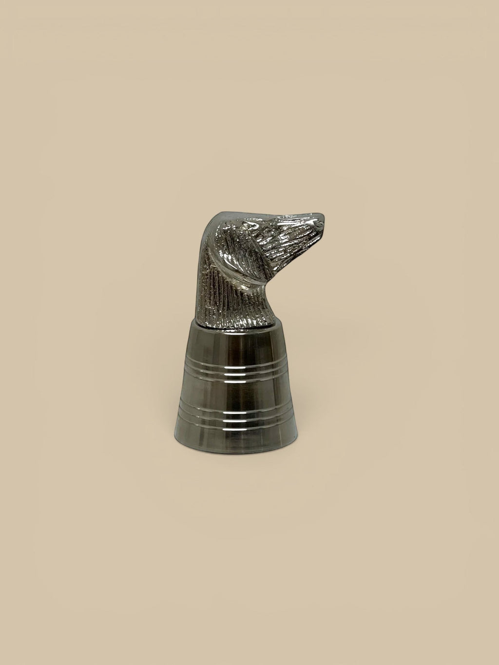 Homestyle Collective silver dog head shot glass with stainless steel measuring body. Detailed sculptural topper.