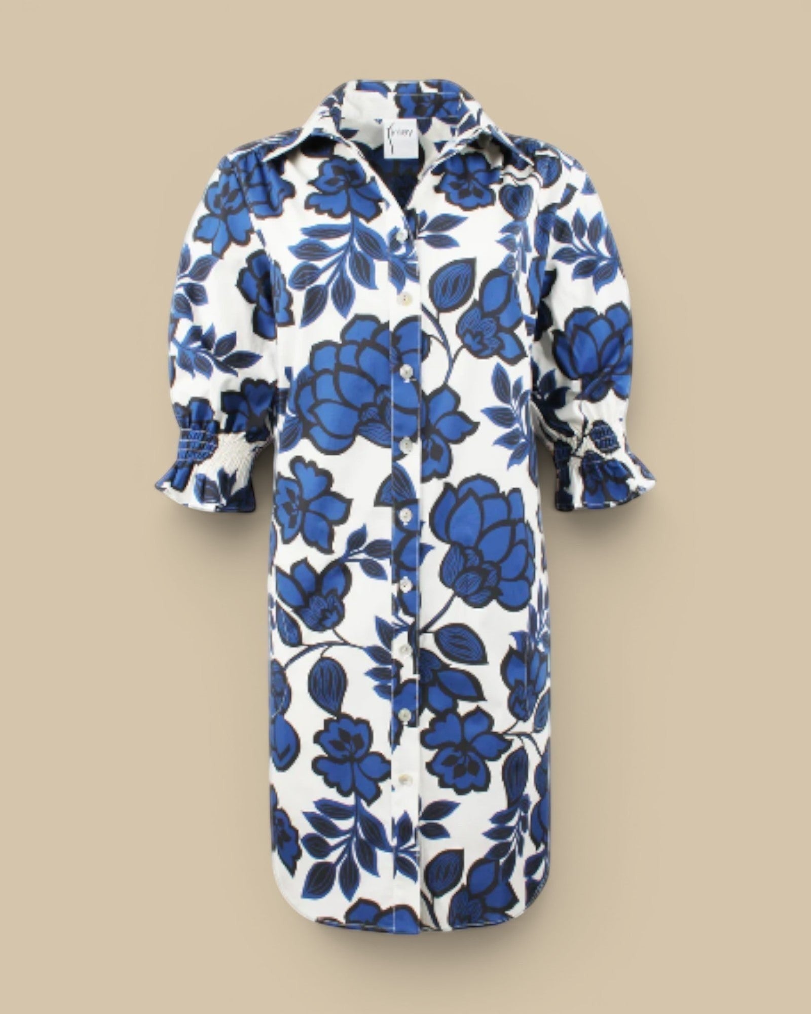 Homestyle Collective Finley Miller navy, white, and black floral print cotton blend shirt dress with puff sleeves and button front.