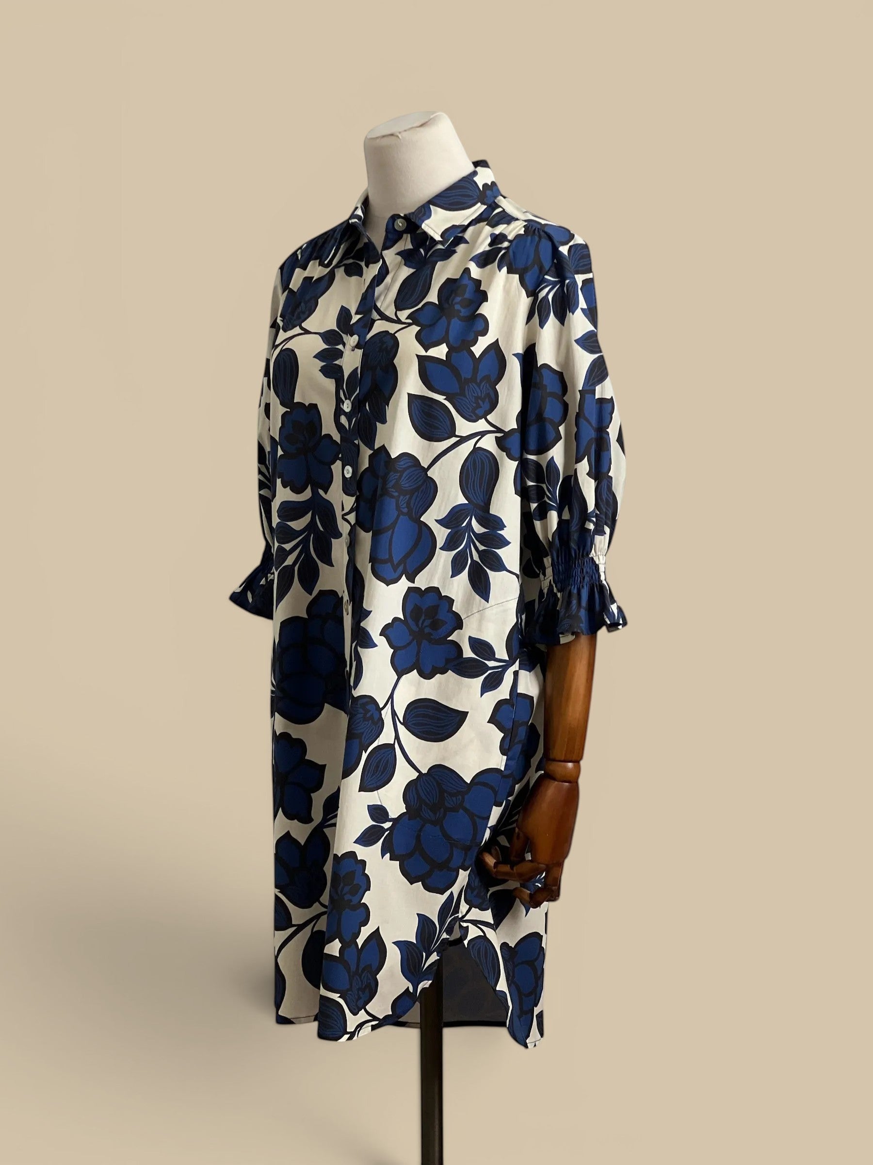 Homestyle Collective Finley Miller navy, white, and black floral print cotton blend shirt dress with puff sleeves and button front.
