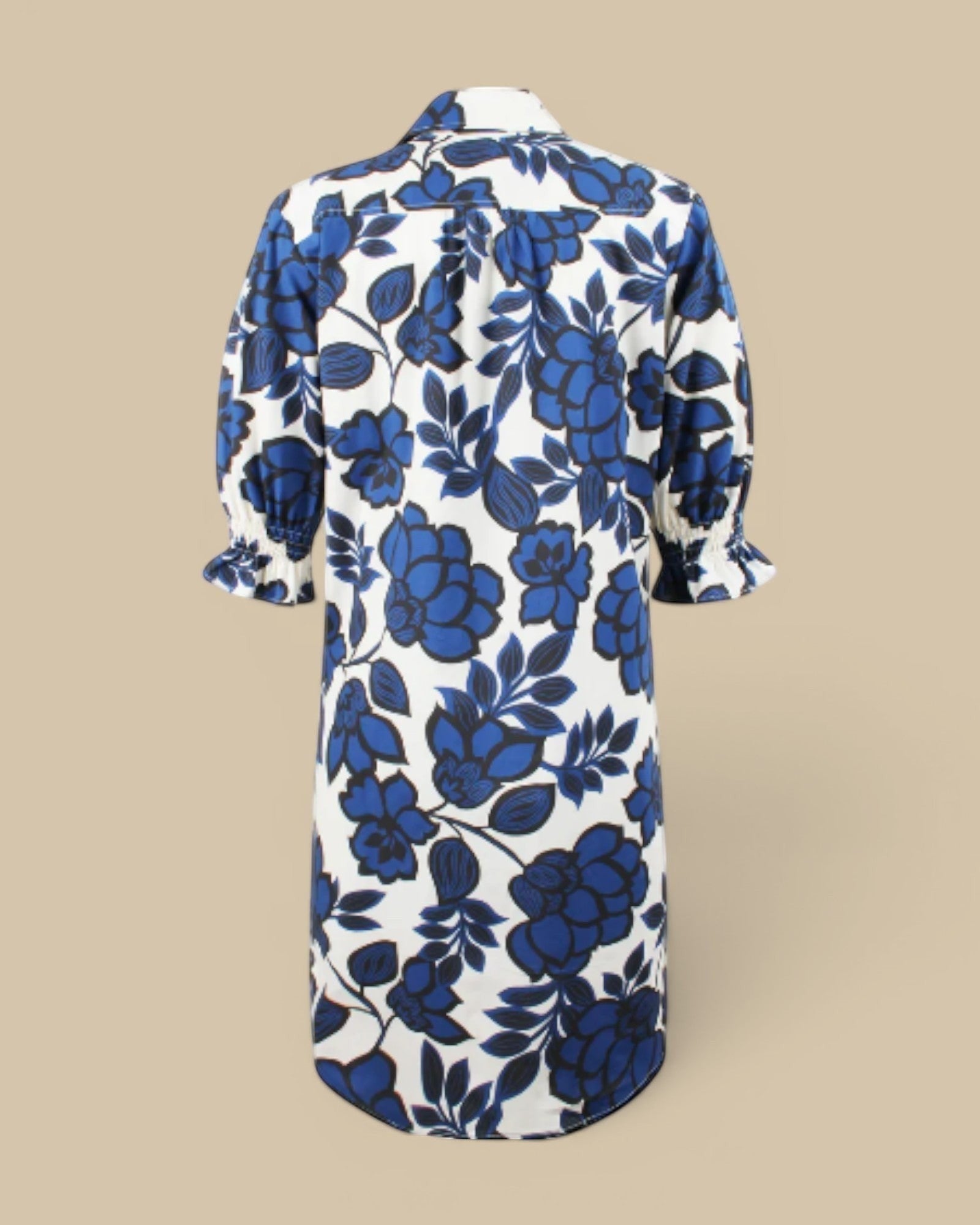 Homestyle Collective Finley Miller navy floral print shirt dress with puff sleeves and smocked cuffs.