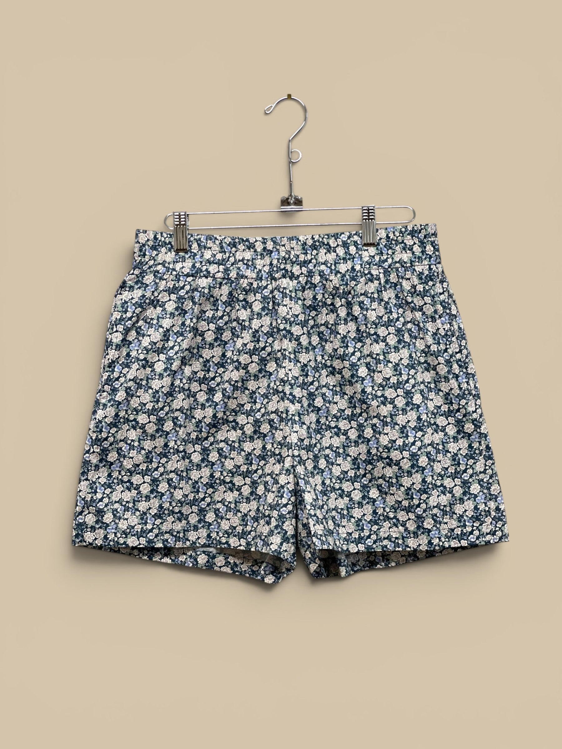 Homestyle Collective navy/blue floral print 100% cotton shorts with elastic waistband and 3" inseam.