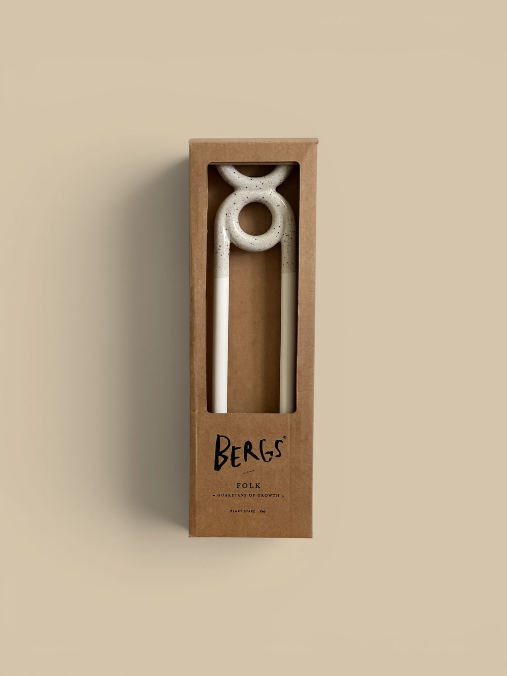 Homestyle Collective Folk plant stake in speckled white and pale yellow ceramic, shaped like a figure.