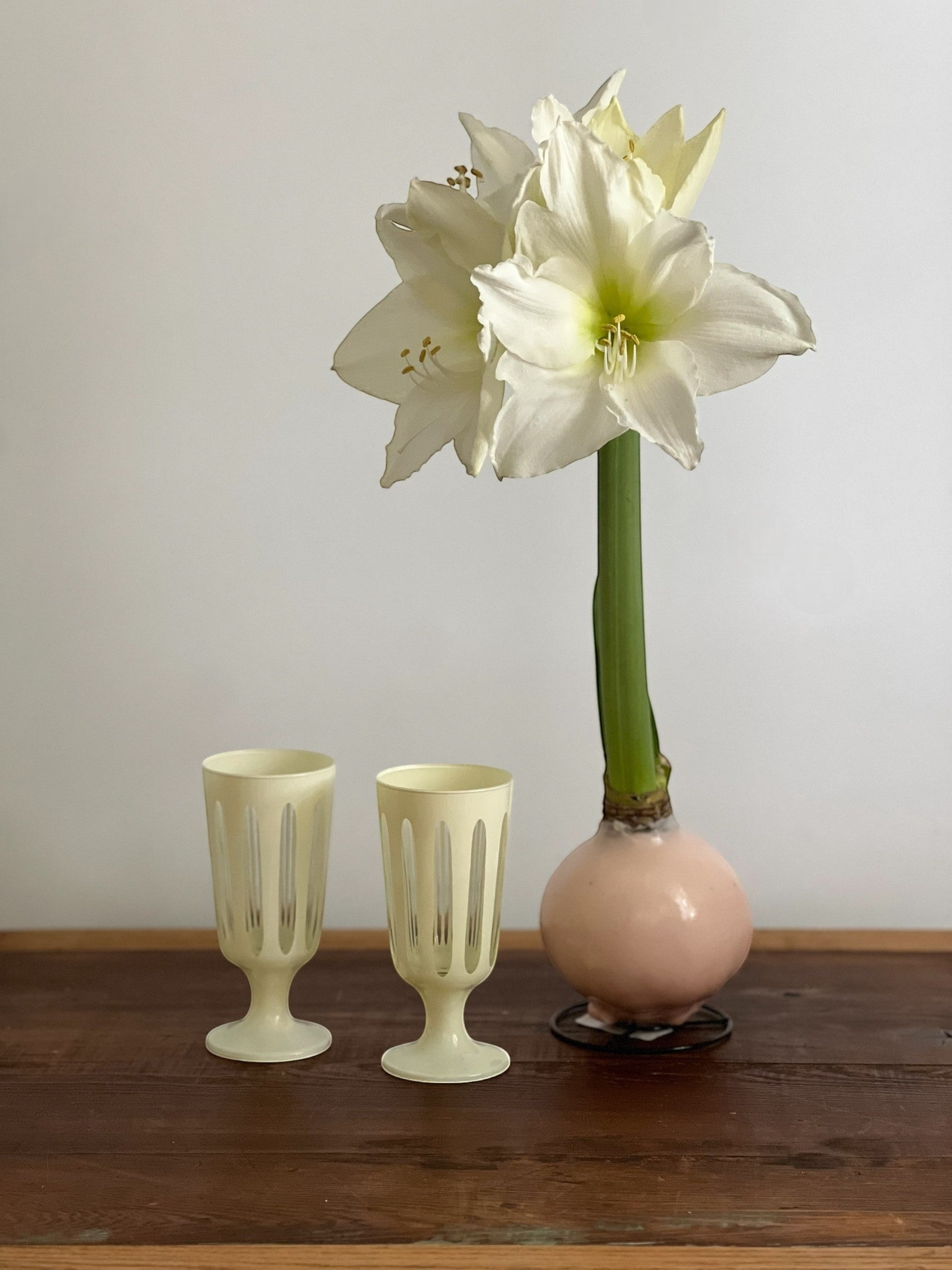 Homestyle Collective Empire Footed Ale Set of 2 glasses in powder white with vertical ribbed detail and footed base.