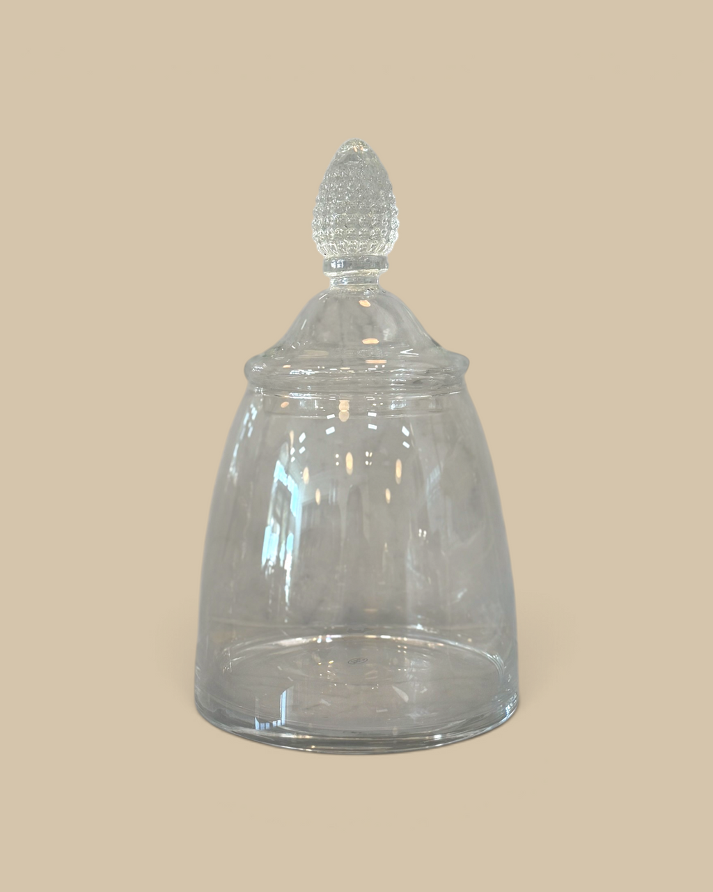 Homestyle Collective glass teardrop jar with a rounded base and decorative finial lid for elegant kitchen storage.