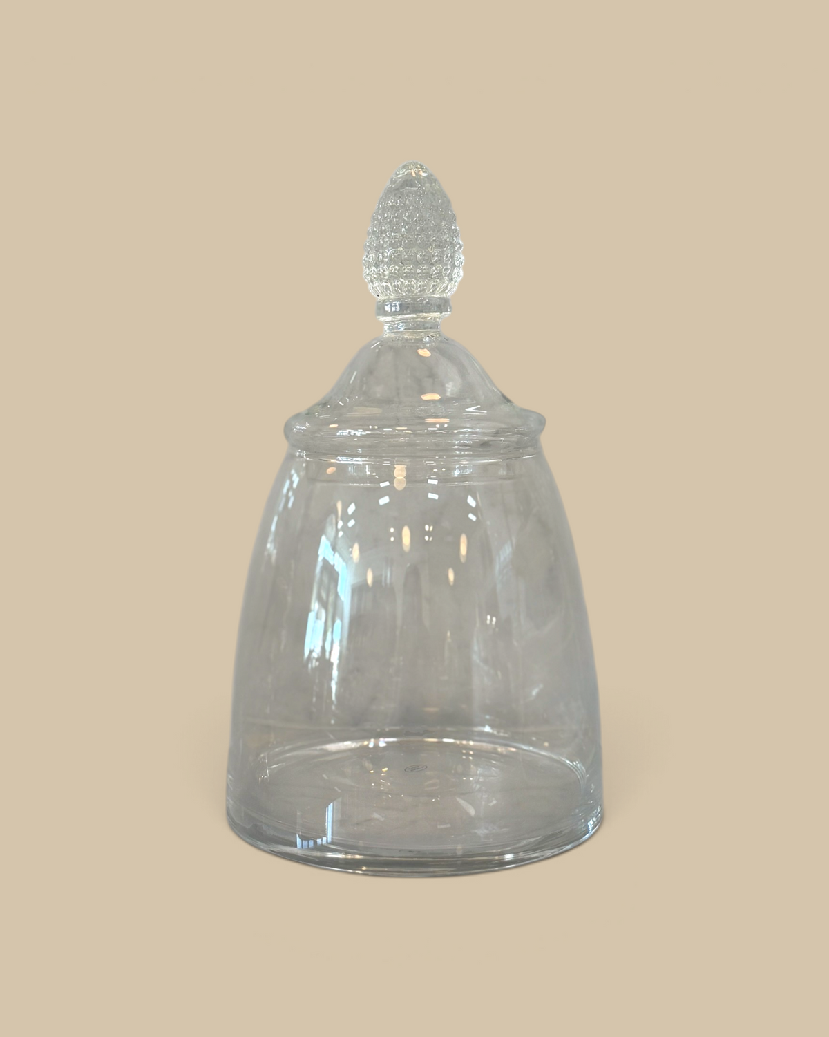 Homestyle Collective glass teardrop jar with a rounded base and decorative finial lid for elegant kitchen storage.