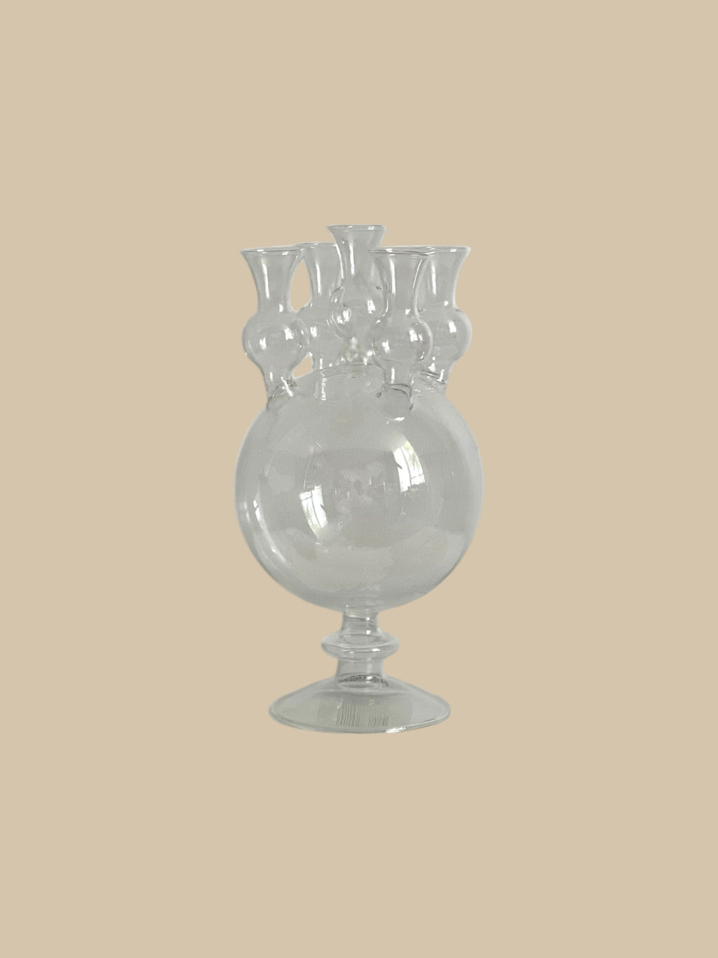 Homestyle Collective clear glass tulipiere vase with five openings and a pedestal base, perfect for single stem floral displays.