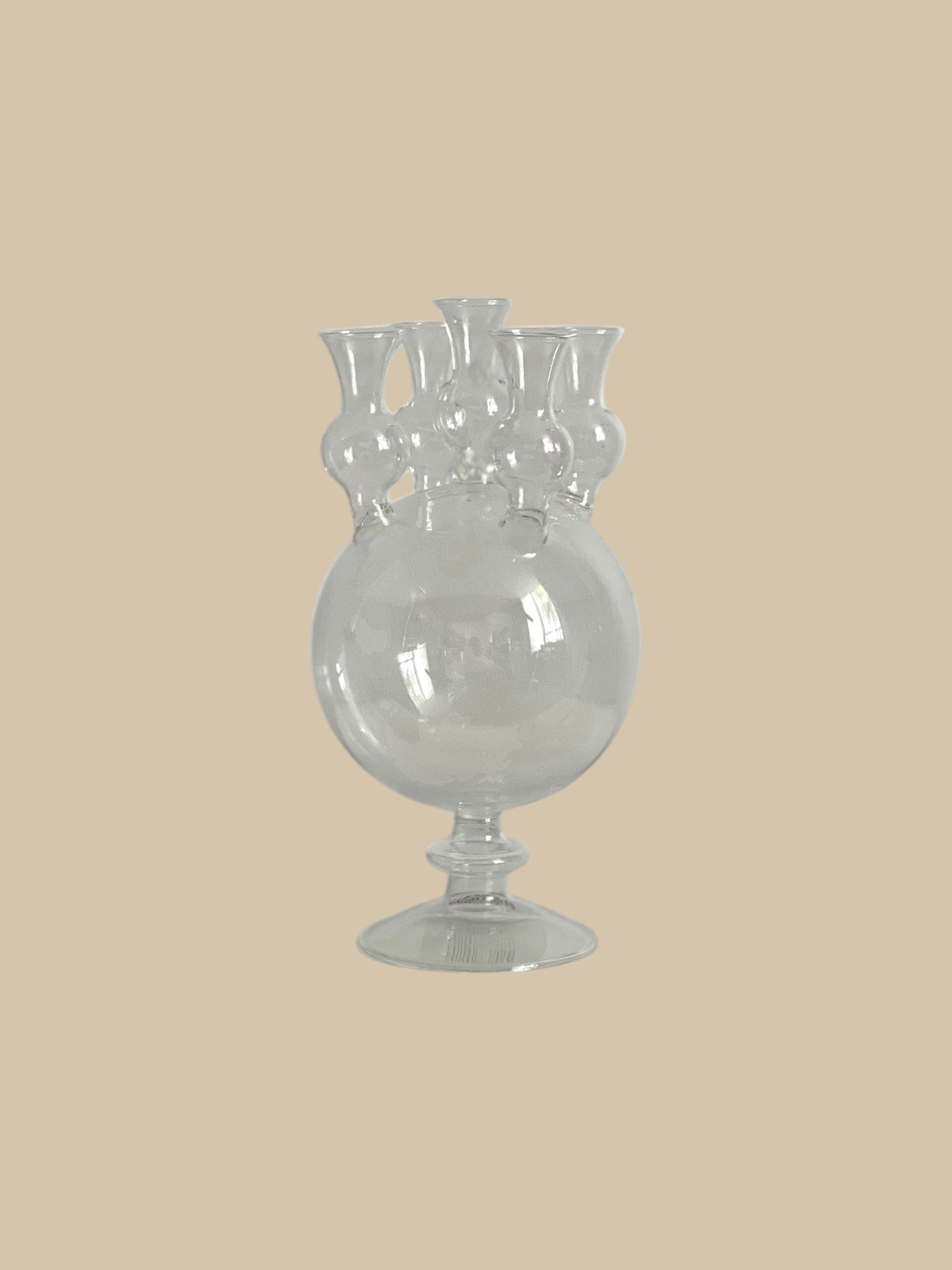 Homestyle Collective clear glass tulipiere vase with five openings and a pedestal base, perfect for single stem floral displays.
