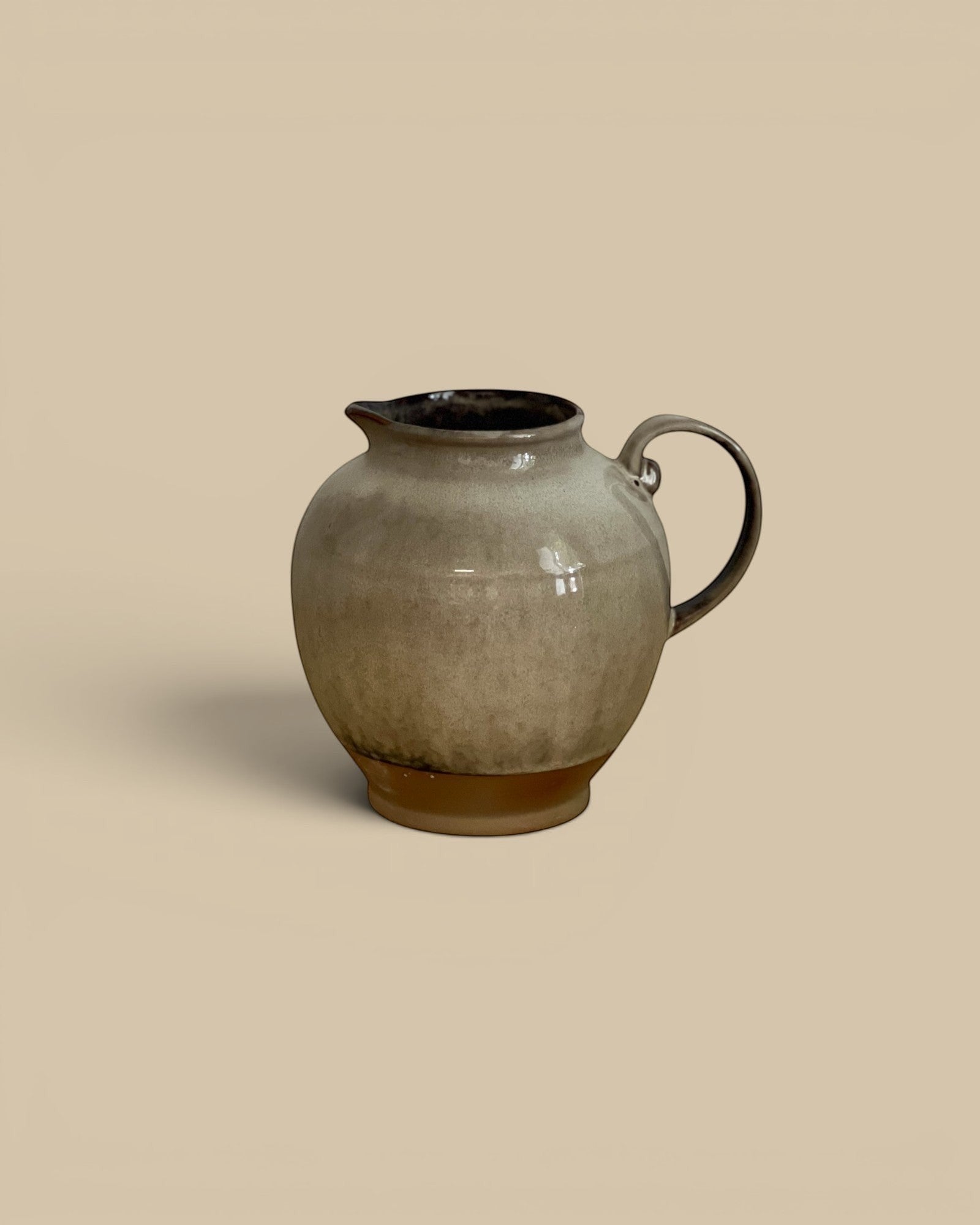 Homestyle Collective Glaze Shift Pitcher, multicolor stoneware, 72 oz capacity, unique reactive glaze finish, artful kitchen décor.