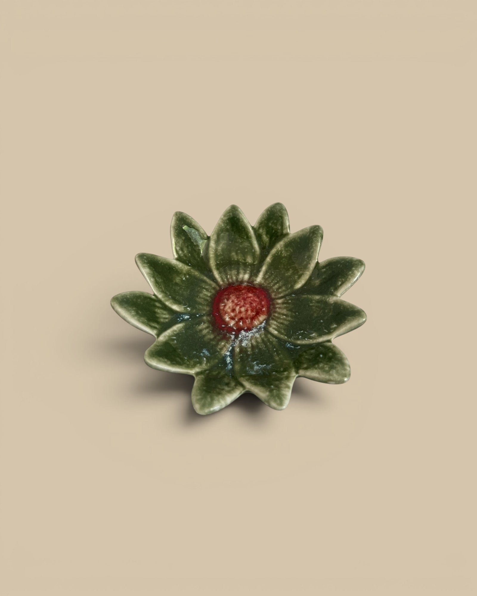 Homestyle Collective green stoneware flower dish with red center, 4.5" round.