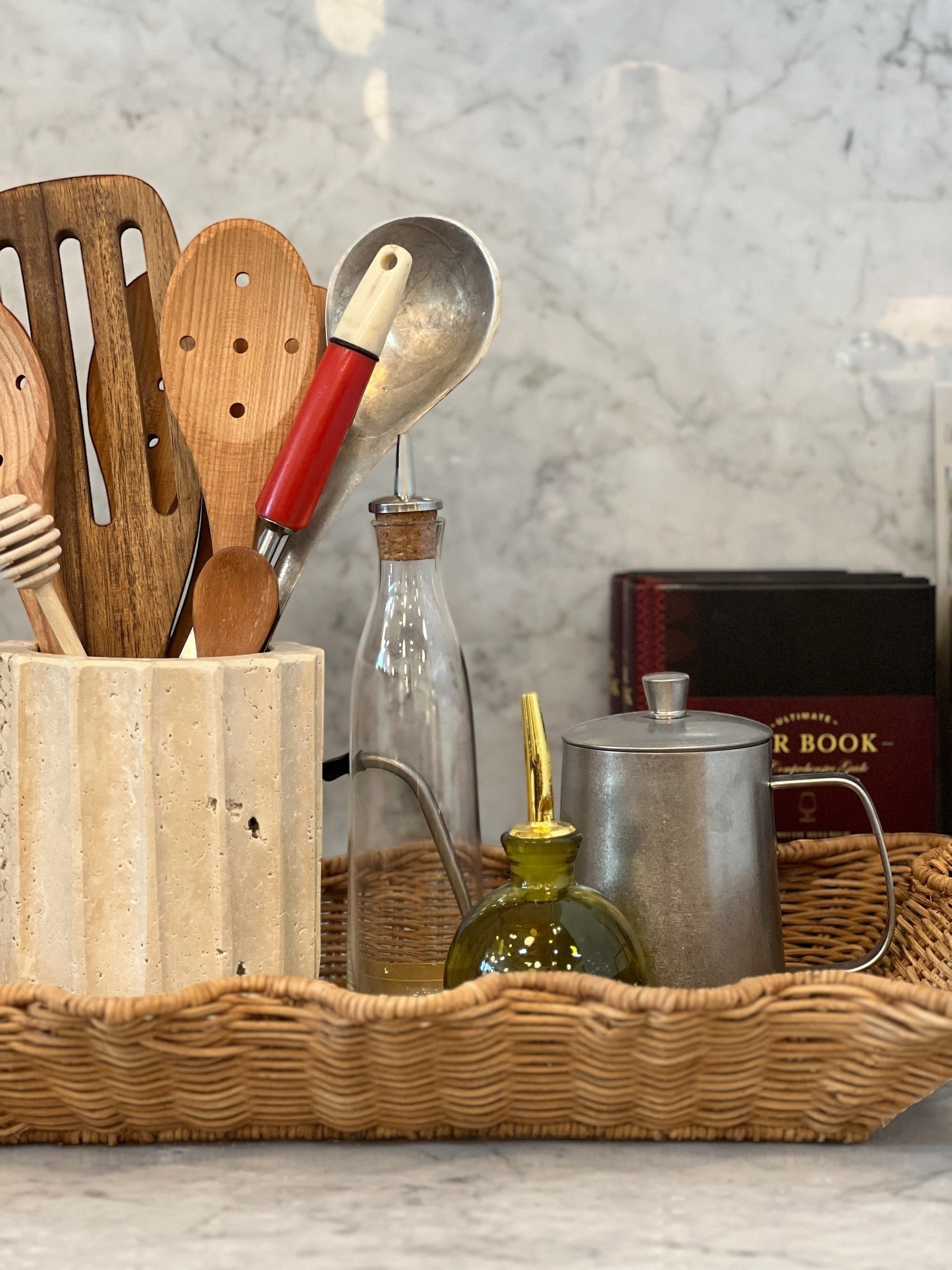 Homestyle Collective Pure Pour Cruet, a small green glass bottle with a gold spout, perfect for oils or dressings.