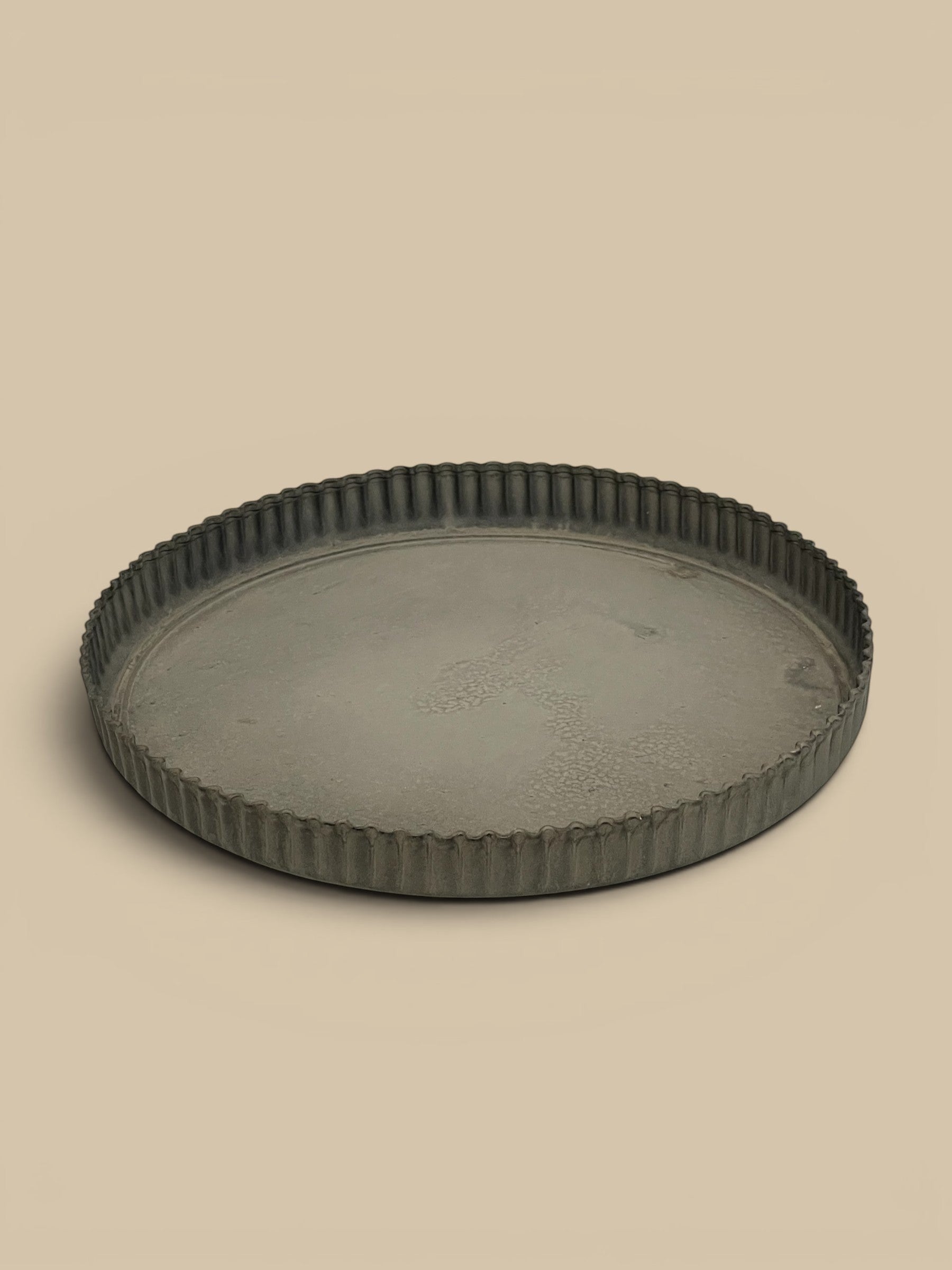 Homestyle Collective grey metal tart tray with crimped edges, vintage-inspired design, 7.5 inches.