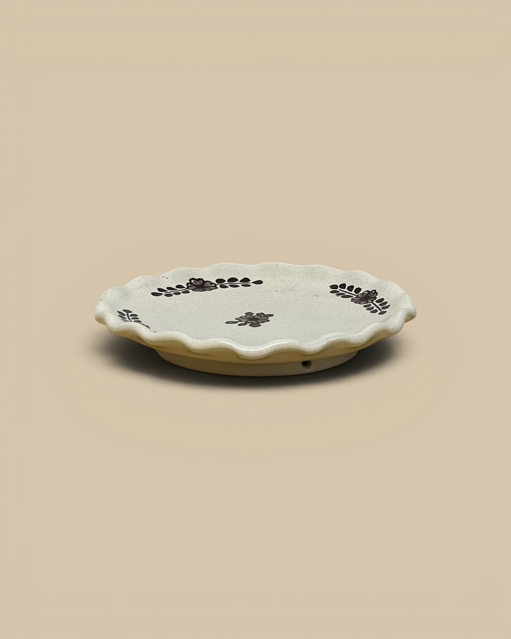 Homestyle Collective hand-painted ceramic dessert plate with scalloped edges and floral motifs in dark brown.