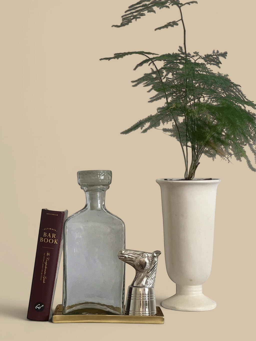 Homestyle Collective silver horse head shot glass with stainless steel measuring body. Sculptural barware.