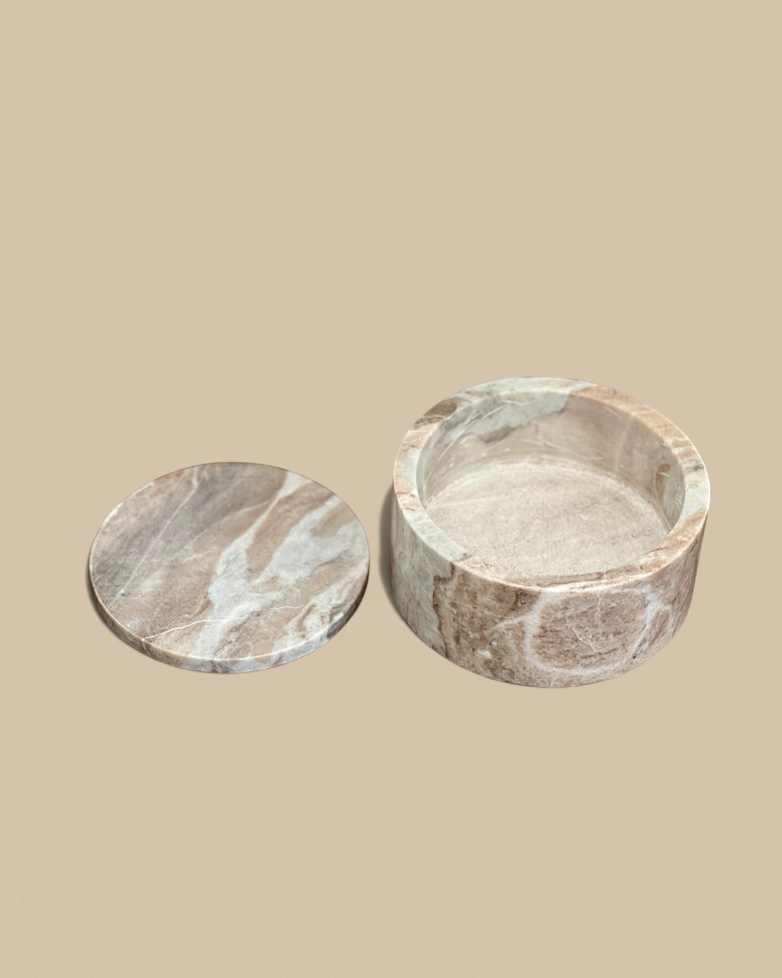 Homestyle Collective Jacqueline round lidded box in brown veined marble with a semi-matte finish.