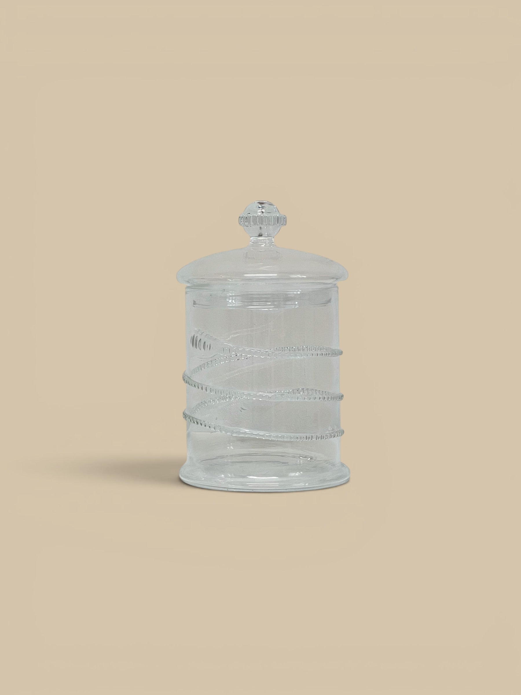 Homestyle Collective Juliet clear glass lidded jars, set of 2, with decorative embossed bands and finial lids.