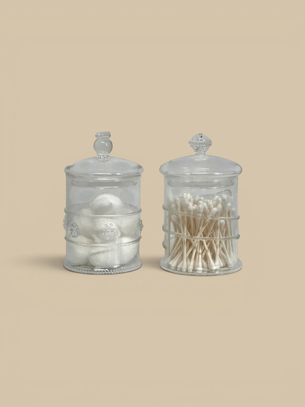 Homestyle Collective Juliet lidded glass jars, set of 2, clear glass with decorative band, one holds cotton balls, the other cotton swabs.