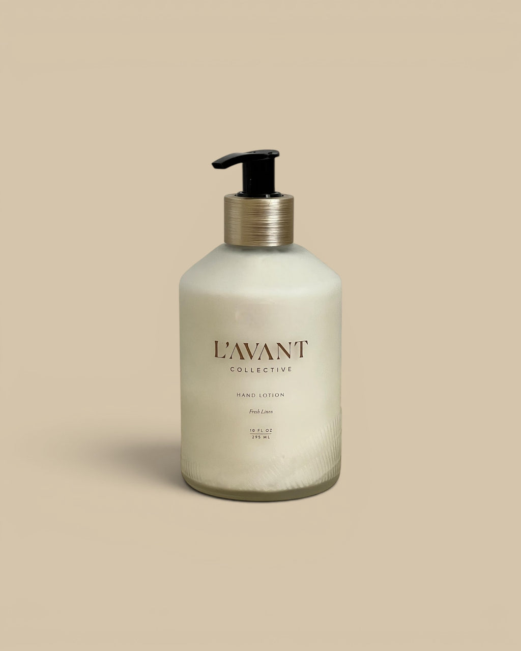 Homestyle Collective L'AVANT Hand Lotion in Fresh Linen scent, 10 fl oz, in a frosted glass bottle with a gold pump dispenser.