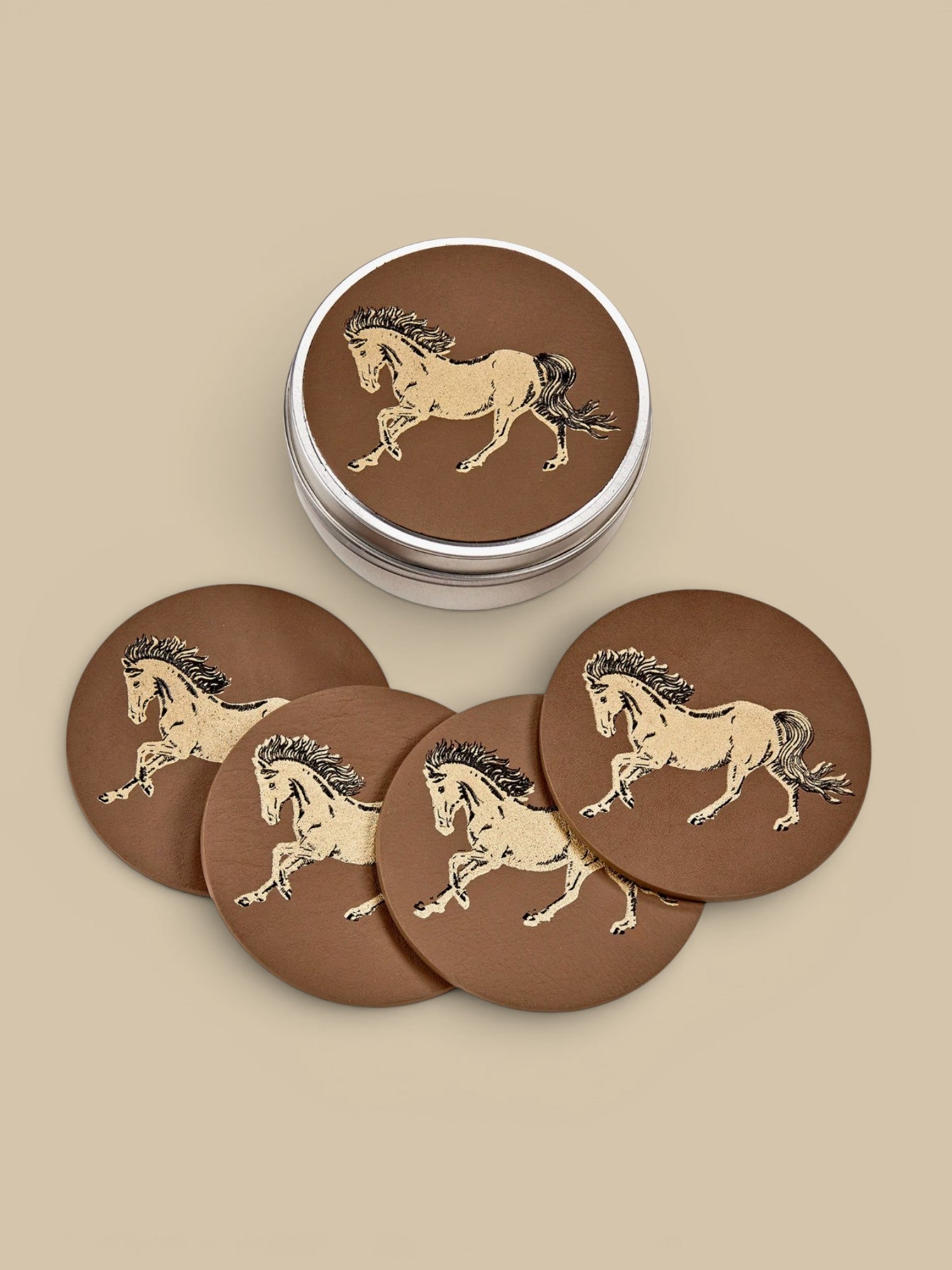Homestyle Collective set of 4 taupe leather coasters with a gold horse design, handcrafted and waterproofed.