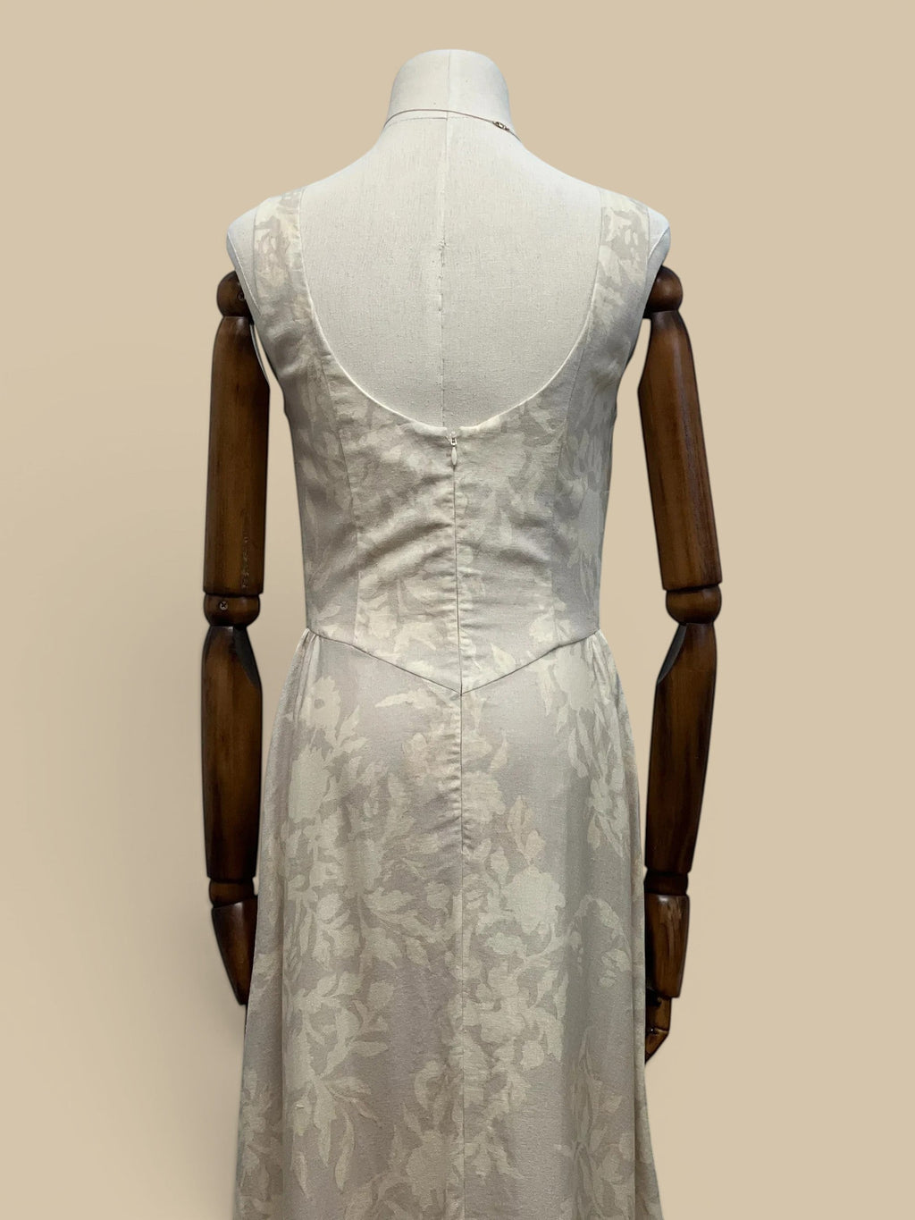 Back view of Homestyle Collective linen floral Parker dress in cream with a scoop neckline and fitted bodice.