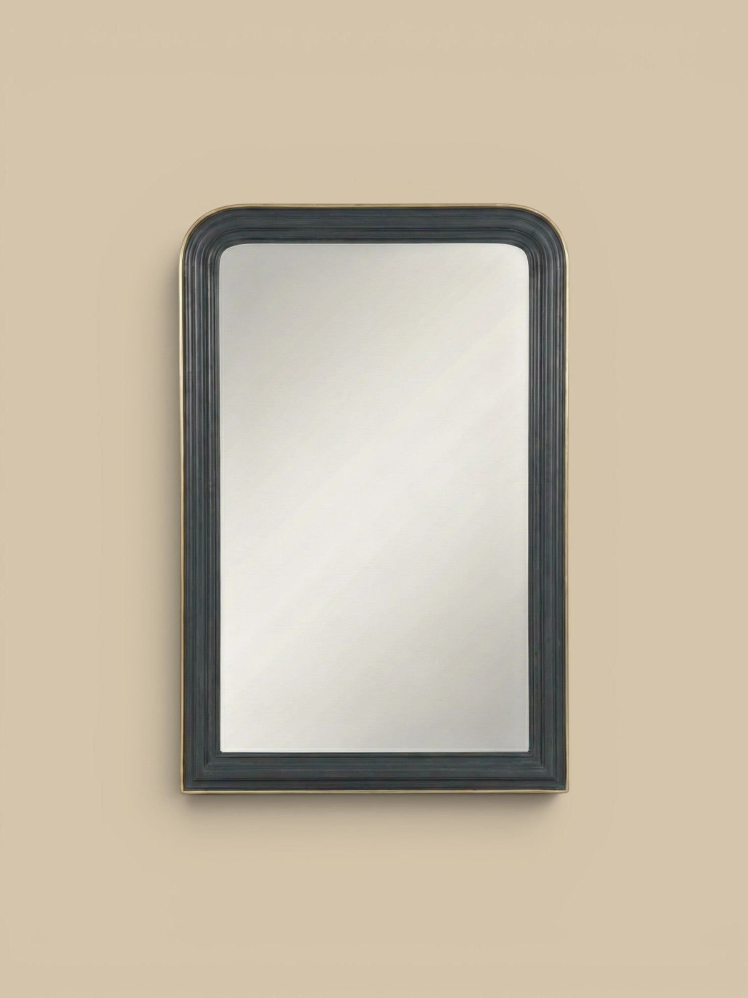 Homestyle Collective Louis Mirror with a dark grey fluted frame and gold trim, featuring rounded corners.
