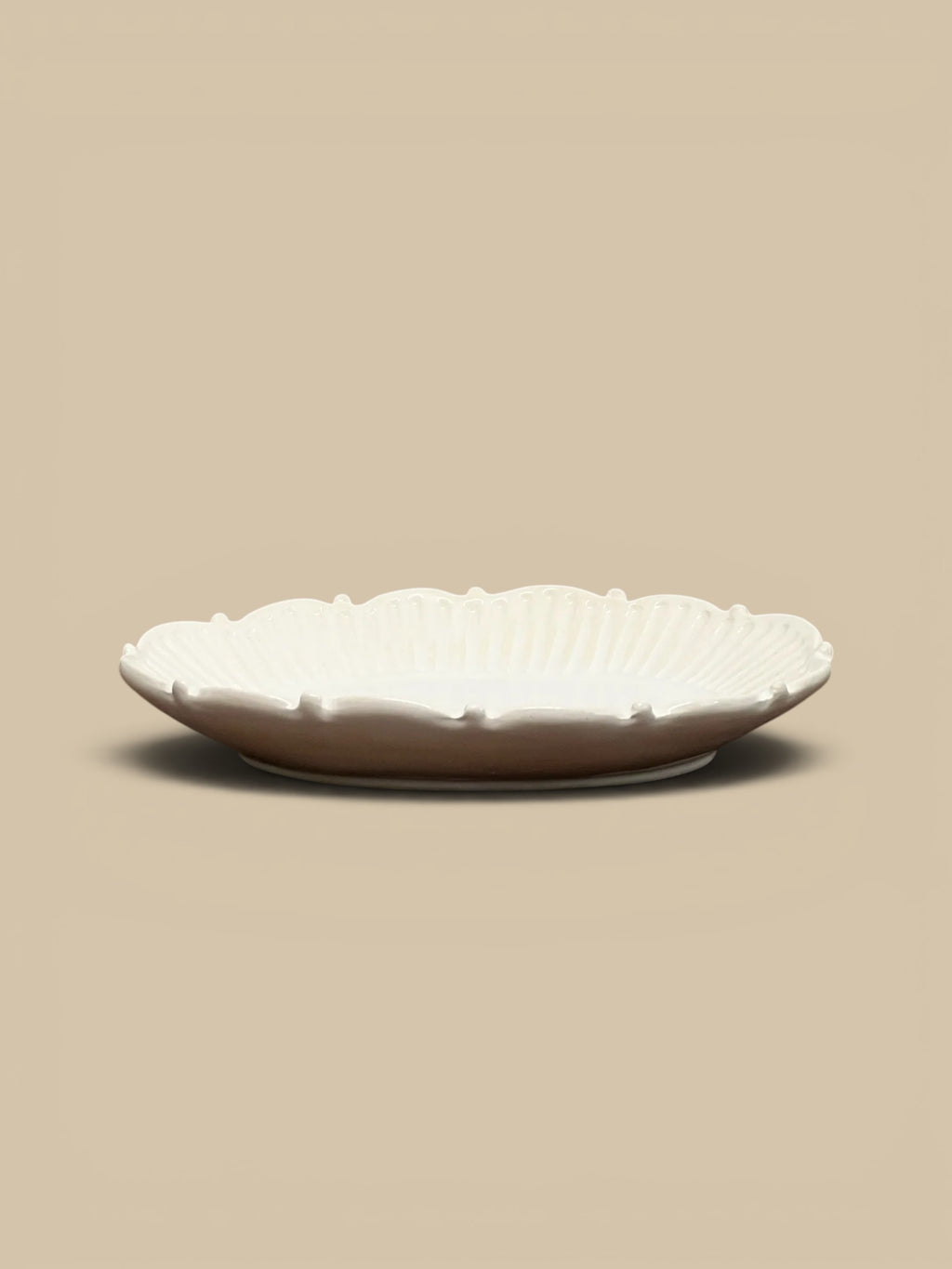 Homestyle Collective Mabel white ceramic serving tray with beaded edge detail and fluted interior, perfect for appetizers or decor.