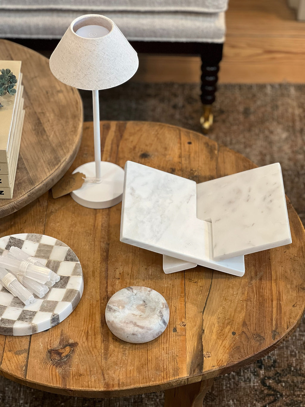 Homestyle Collective interlocking white marble book display stand for books and cookbooks.
