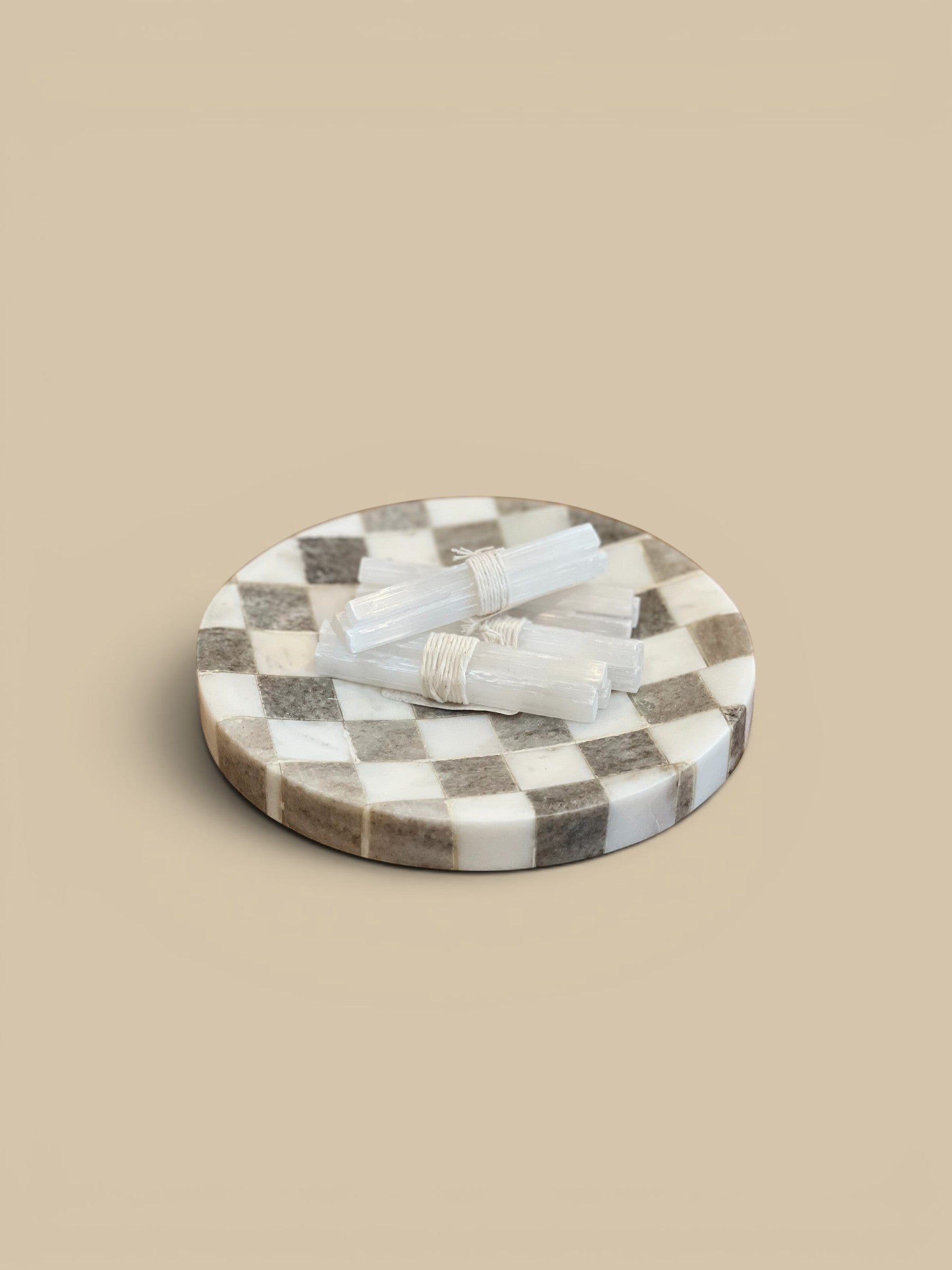Homestyle Collective Gridstone Marble Tray with checkered pattern in buff and white squares, 8" round.