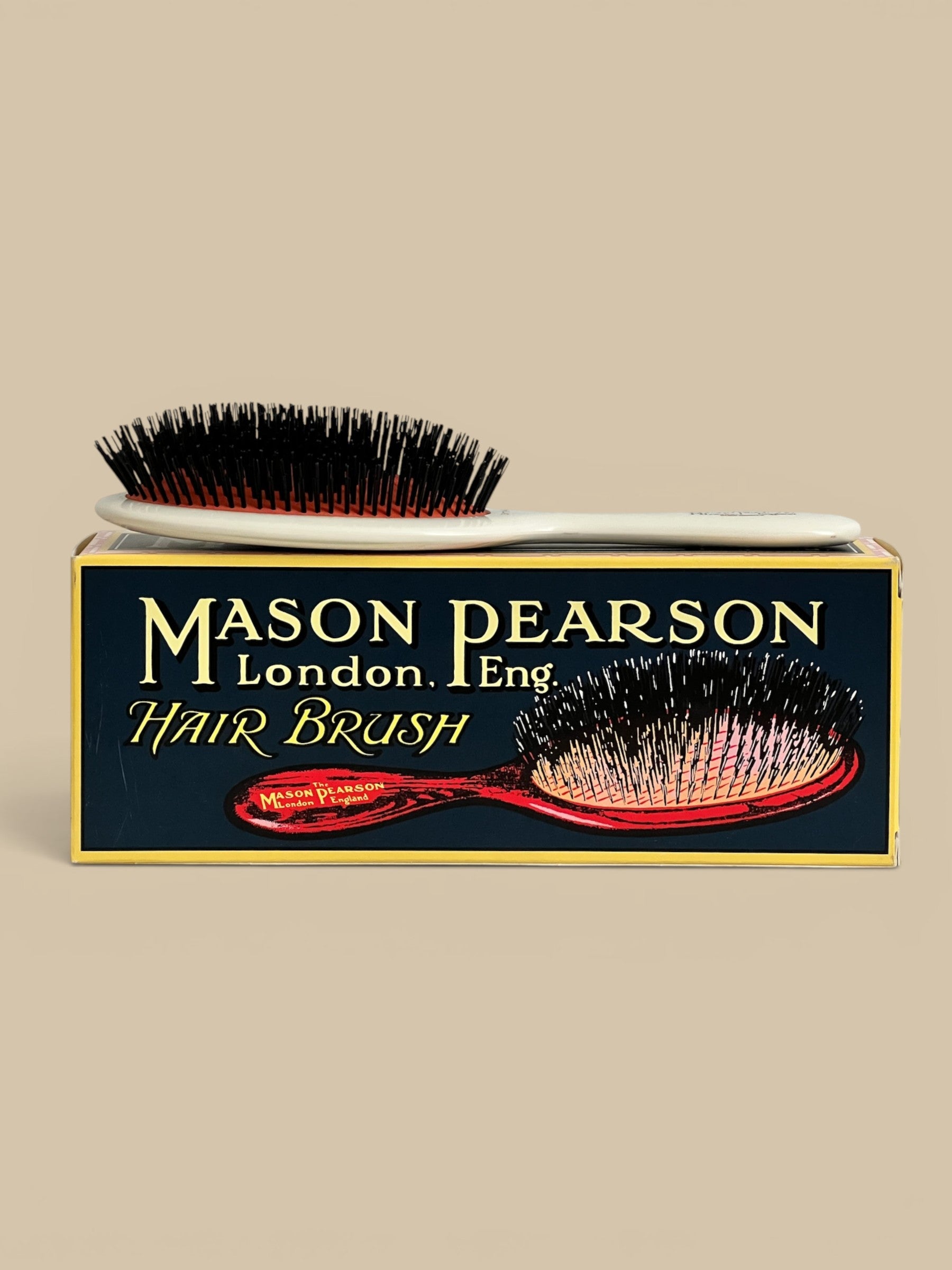 Homestyle Collective Mason Pearson Small Extra Boar Bristle Hairbrush with white handle and black bristles.