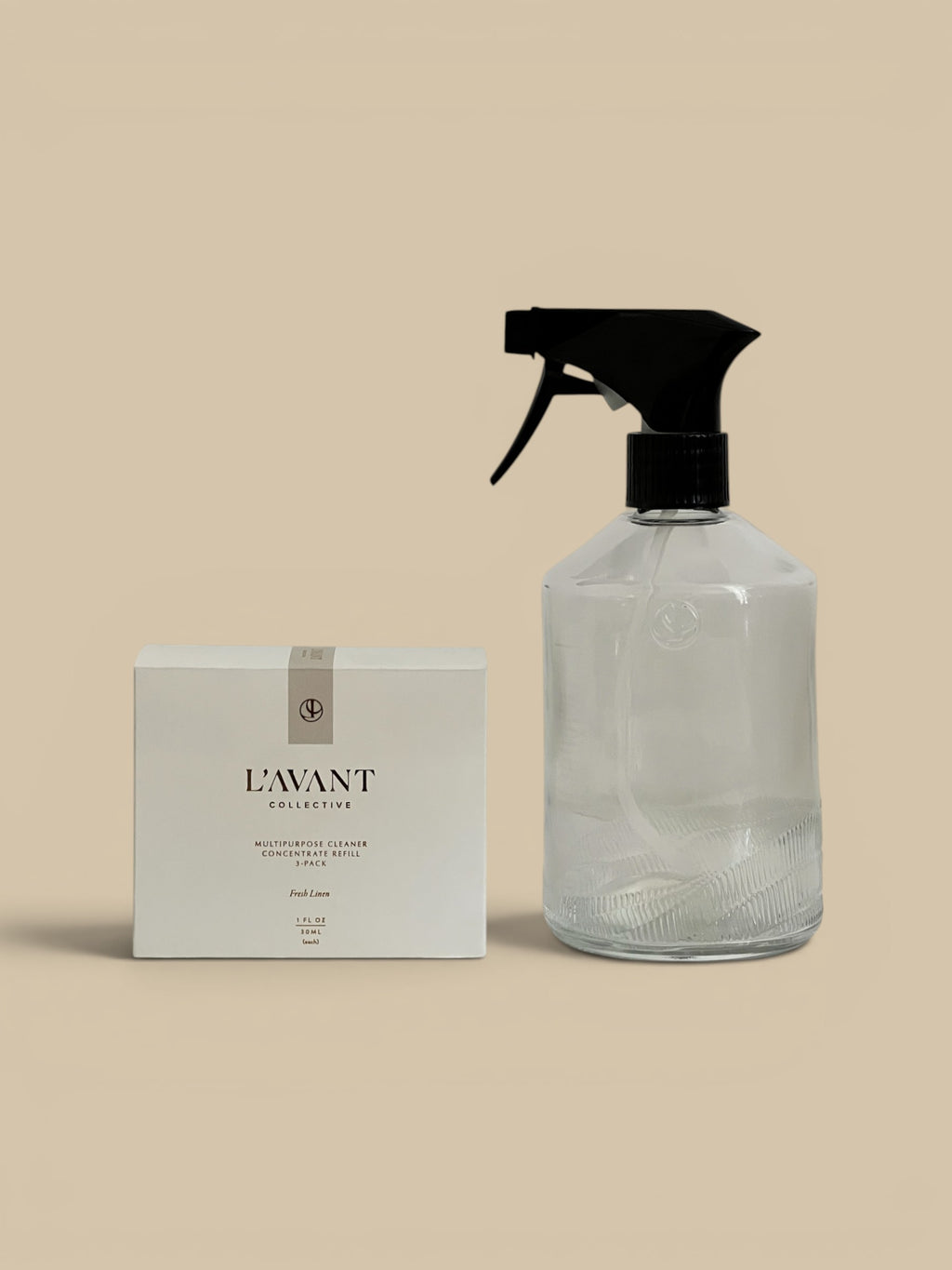 Homestyle Collective L'avant Multipurpose Cleaner Concentrate Refill 3-pack in Fresh Linen scent with a clear spray bottle.