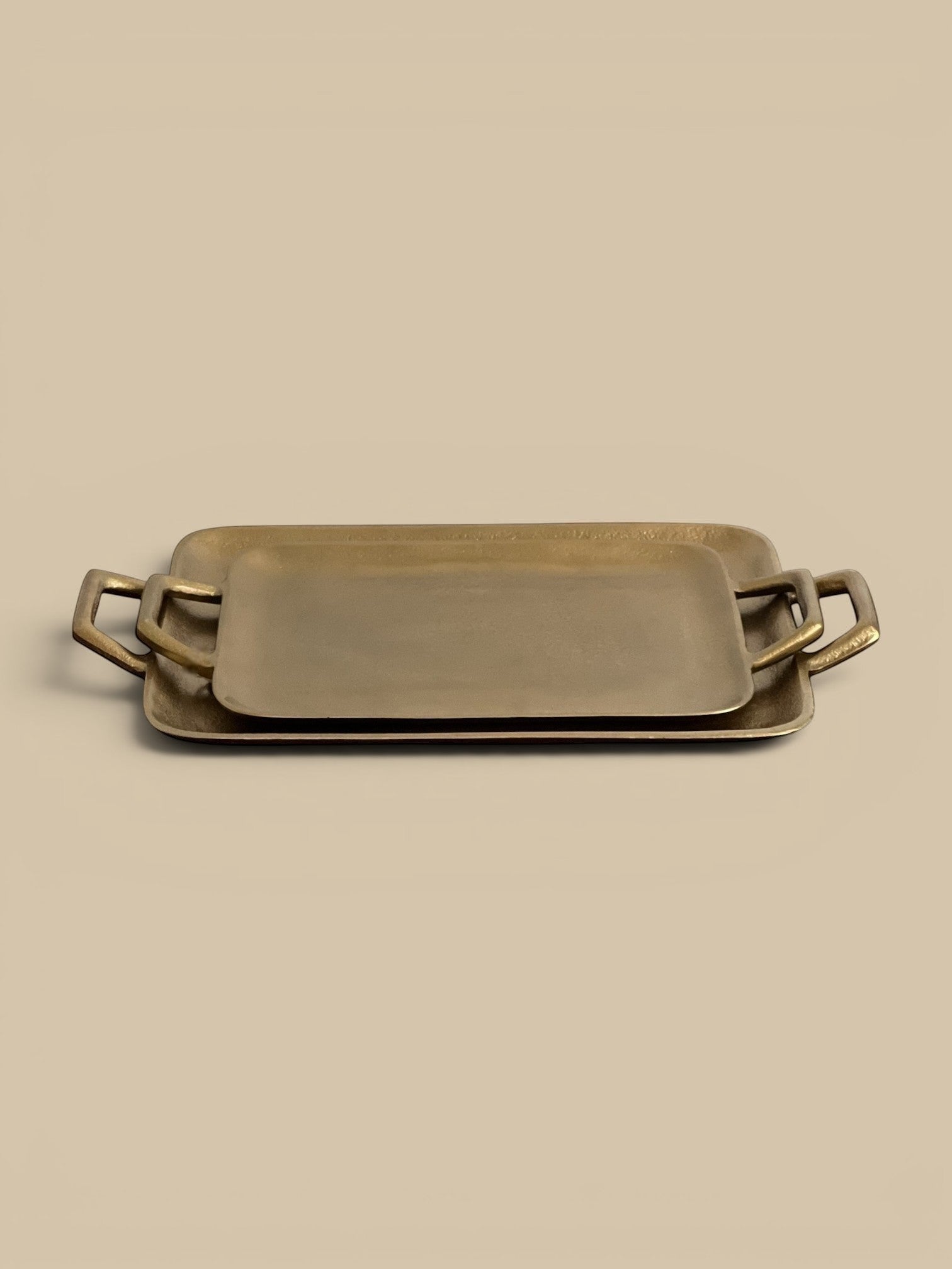 Homestyle Collective Murray brass tray with sturdy handles, cast aluminum, shallow profile, available in small and large sizes.