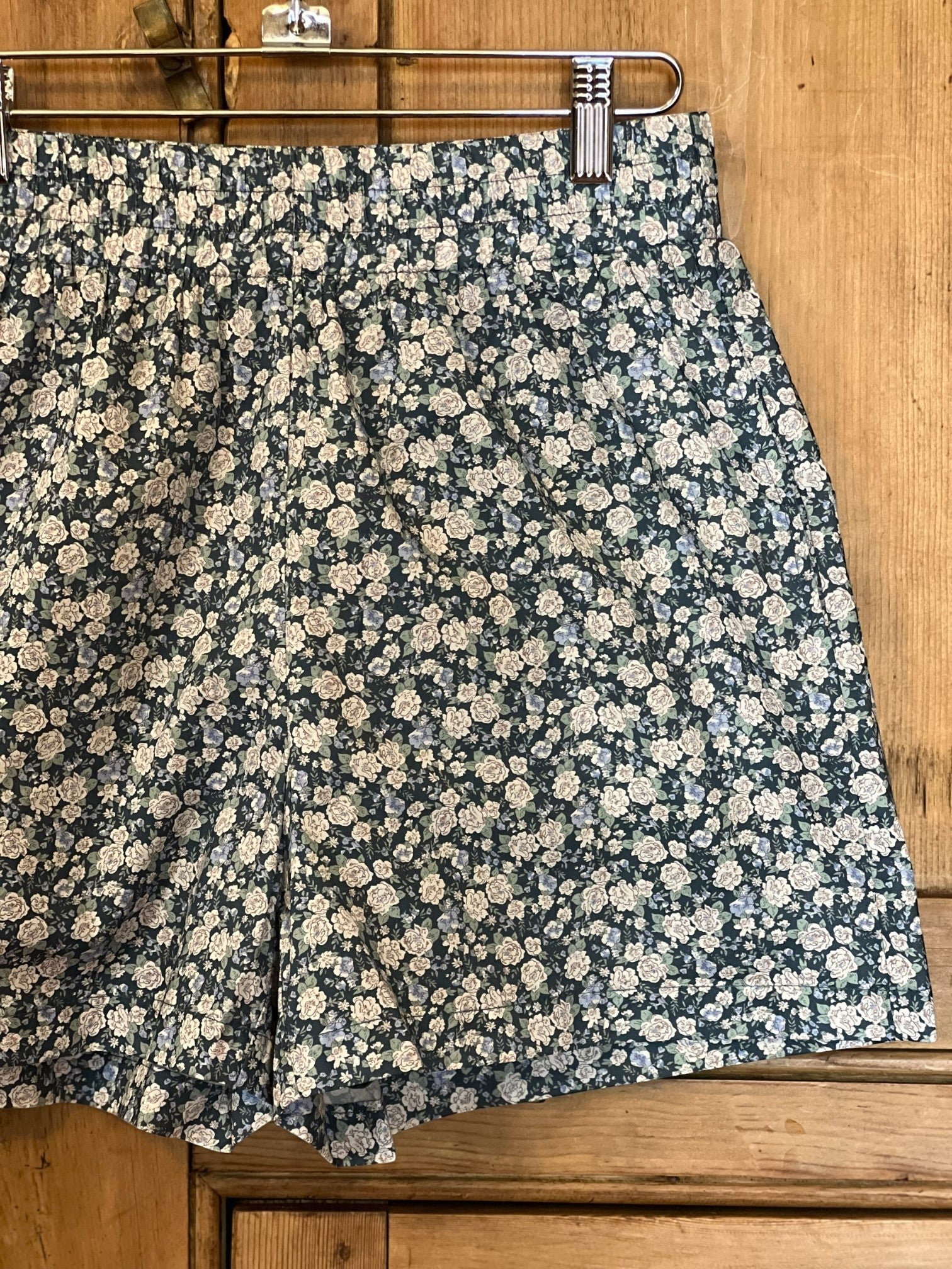 Homestyle Collective navy blue floral print 100% cotton shorts with elastic waistband and 3" inseam.