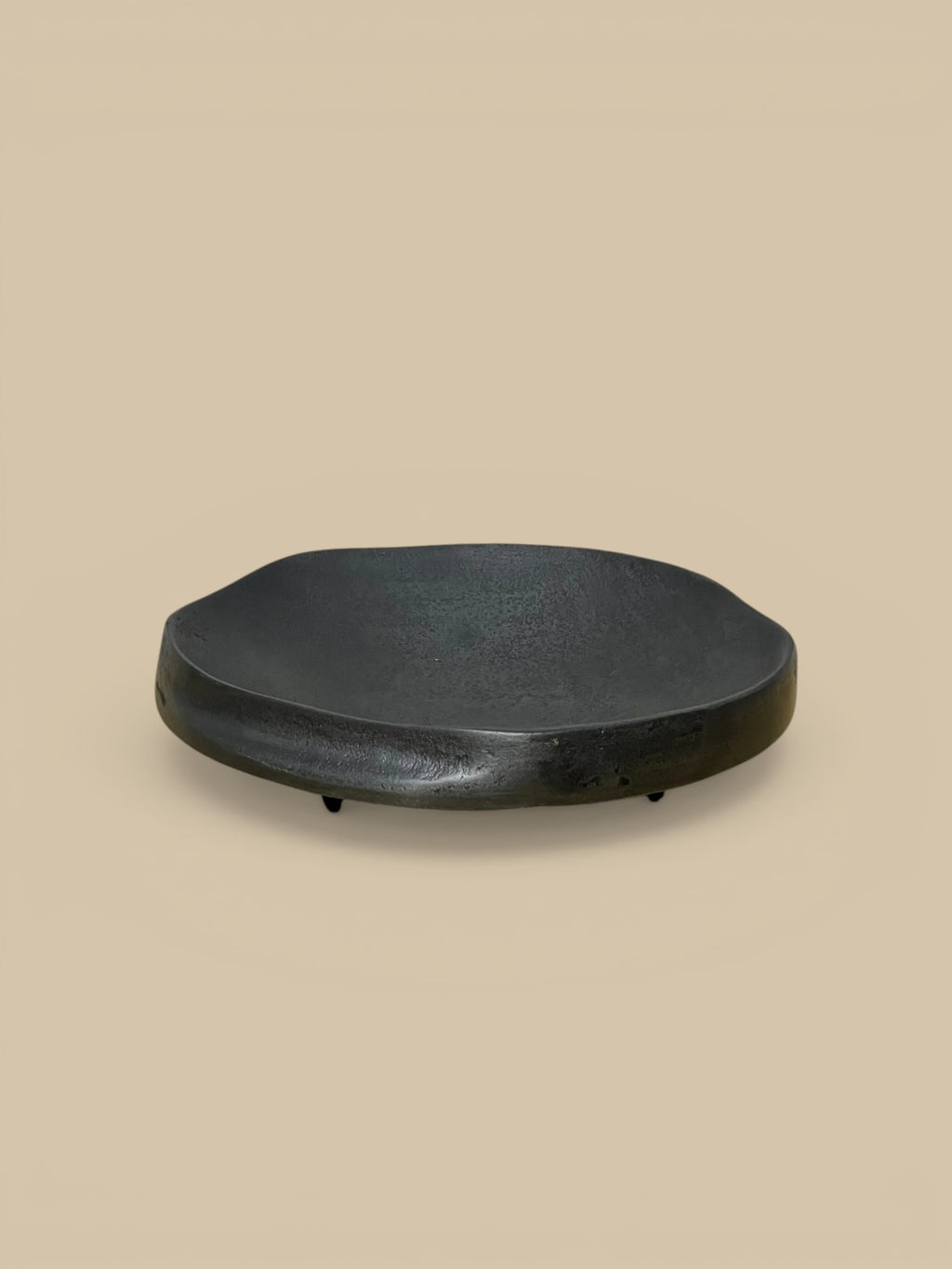 Homestyle Collective The Nightfall matte black aluminum footed dish with organic shape and subtle indentation. 8" Round x 2" H.