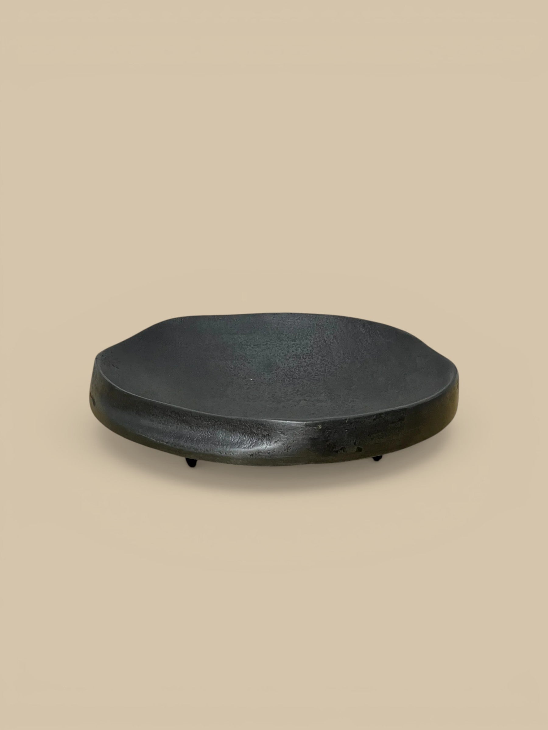 Homestyle Collective The Nightfall matte black aluminum footed dish with organic shape and subtle indentation. 8" Round x 2" H.