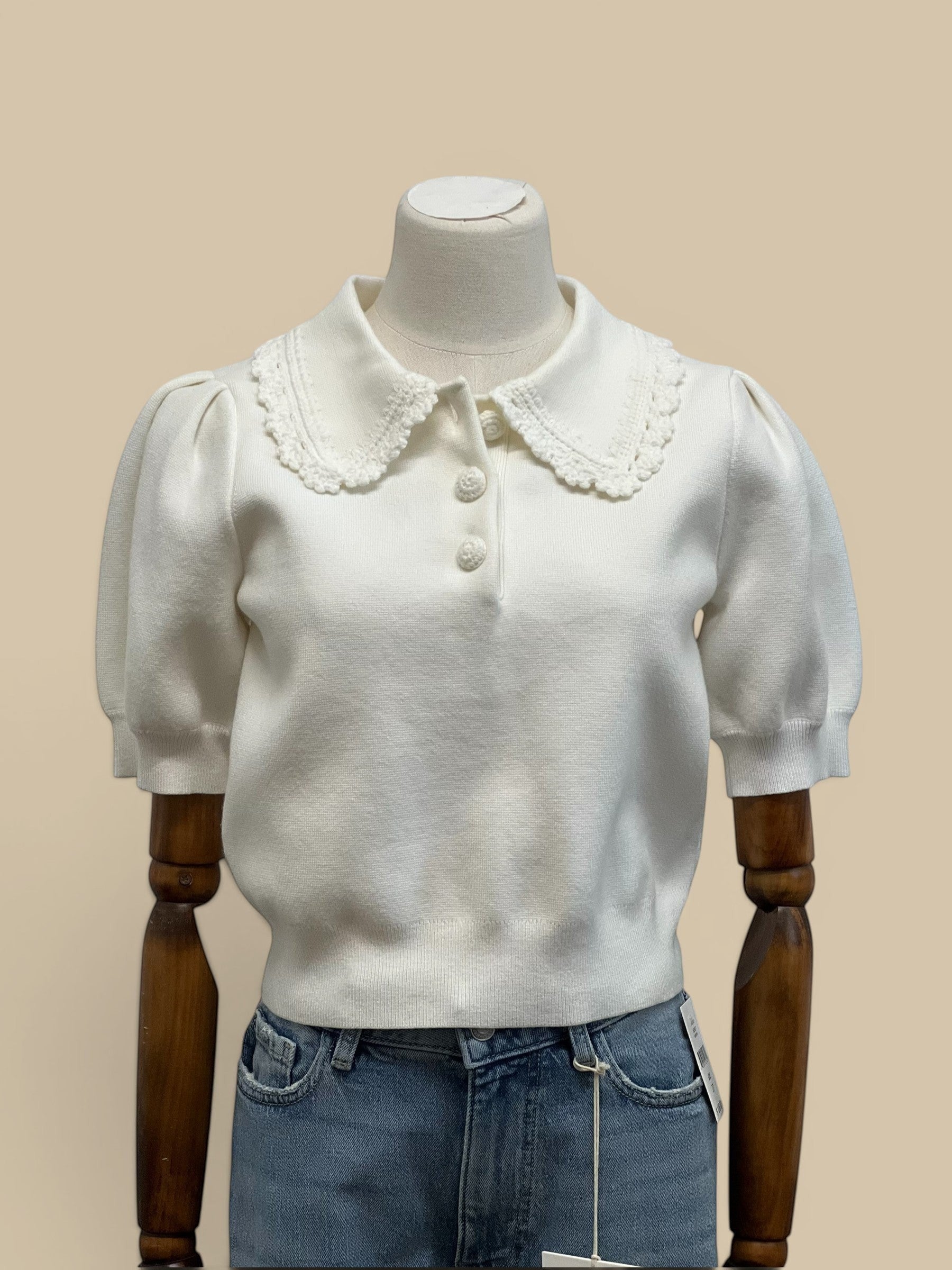 Homestyle Collective off-white knit top with short puff sleeves and a decorative scalloped collar with button details.