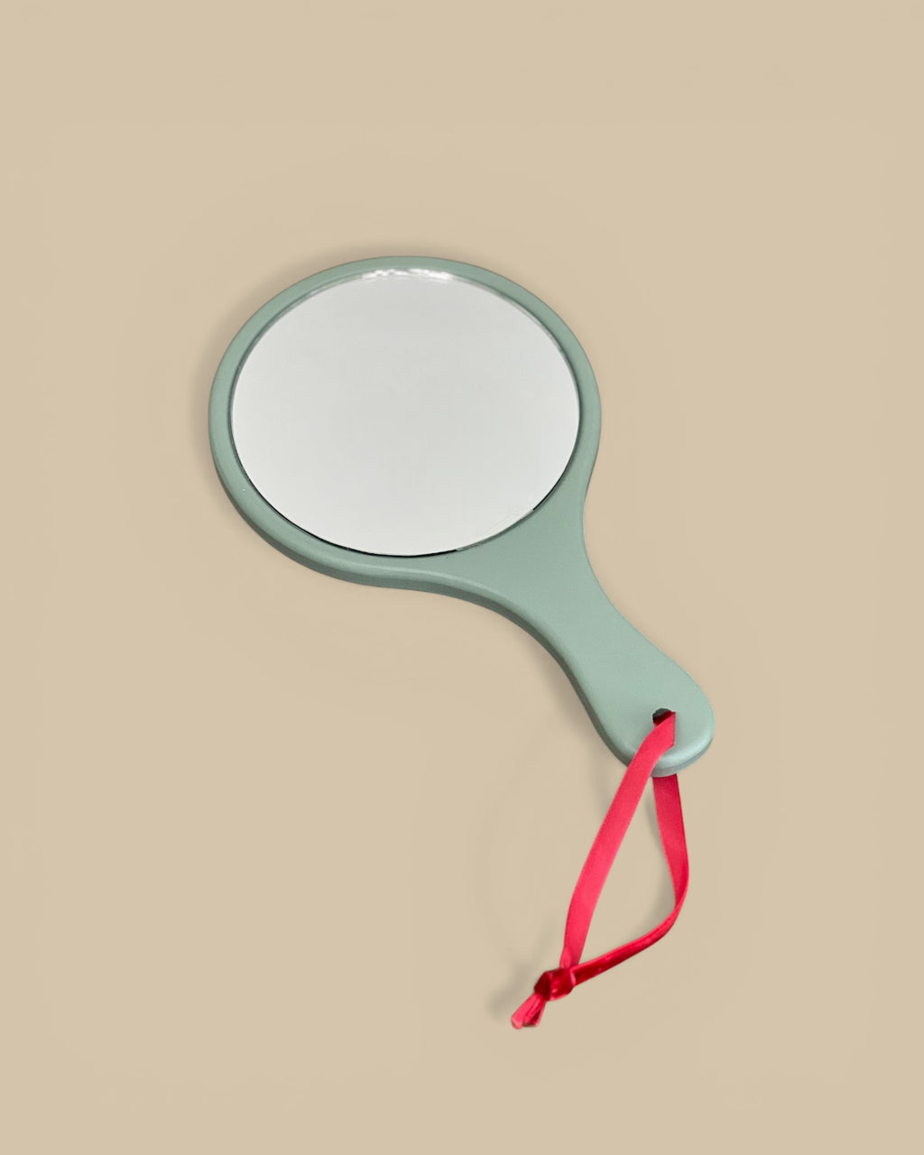 Homestyle Collective pale blue painted wood hand mirror with floral motif and red velvet ribbon.