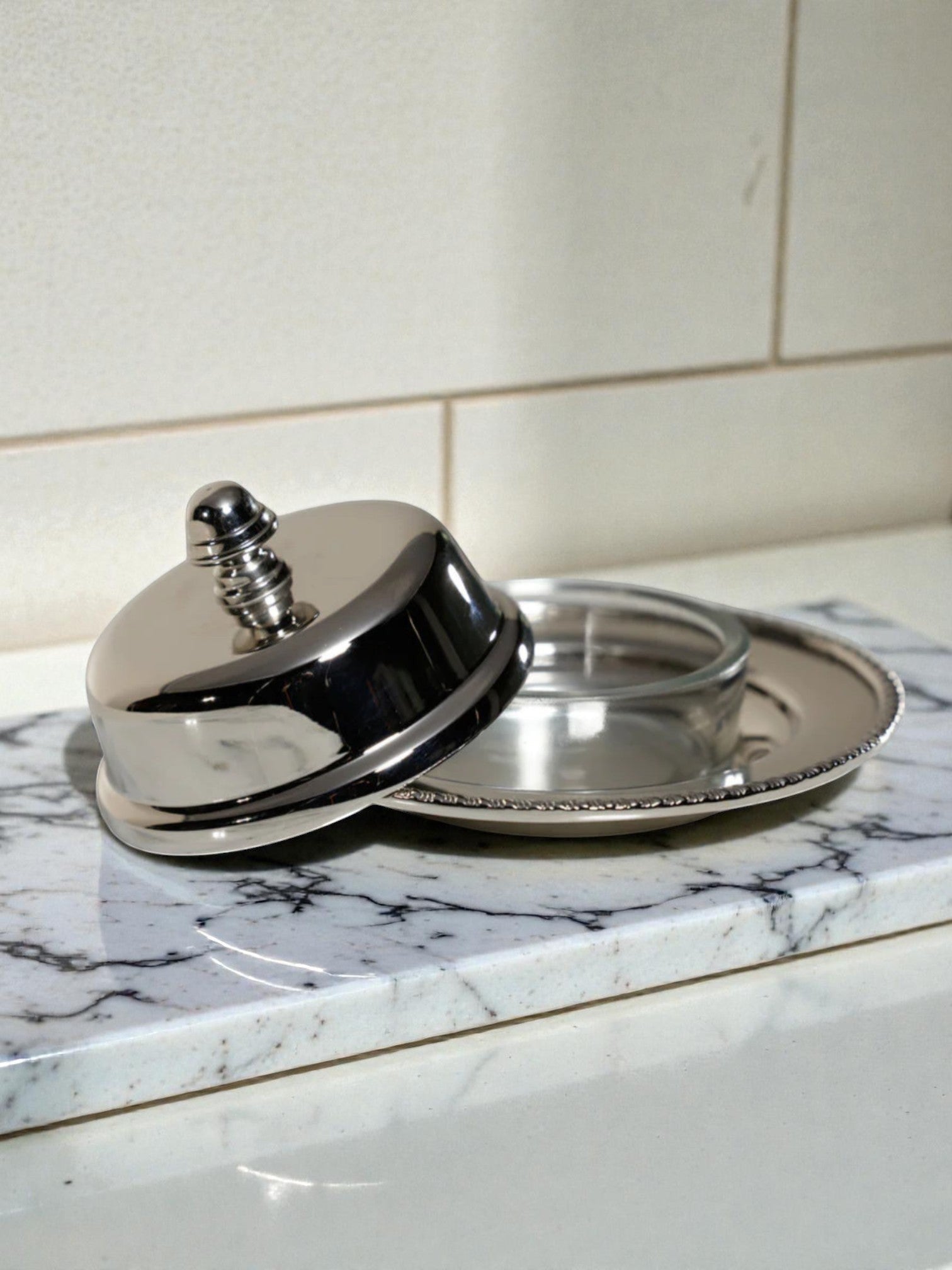 Homestyle Collective silver and glass Parisian butter dish with decorative lid knob. Perfect for serving butter.