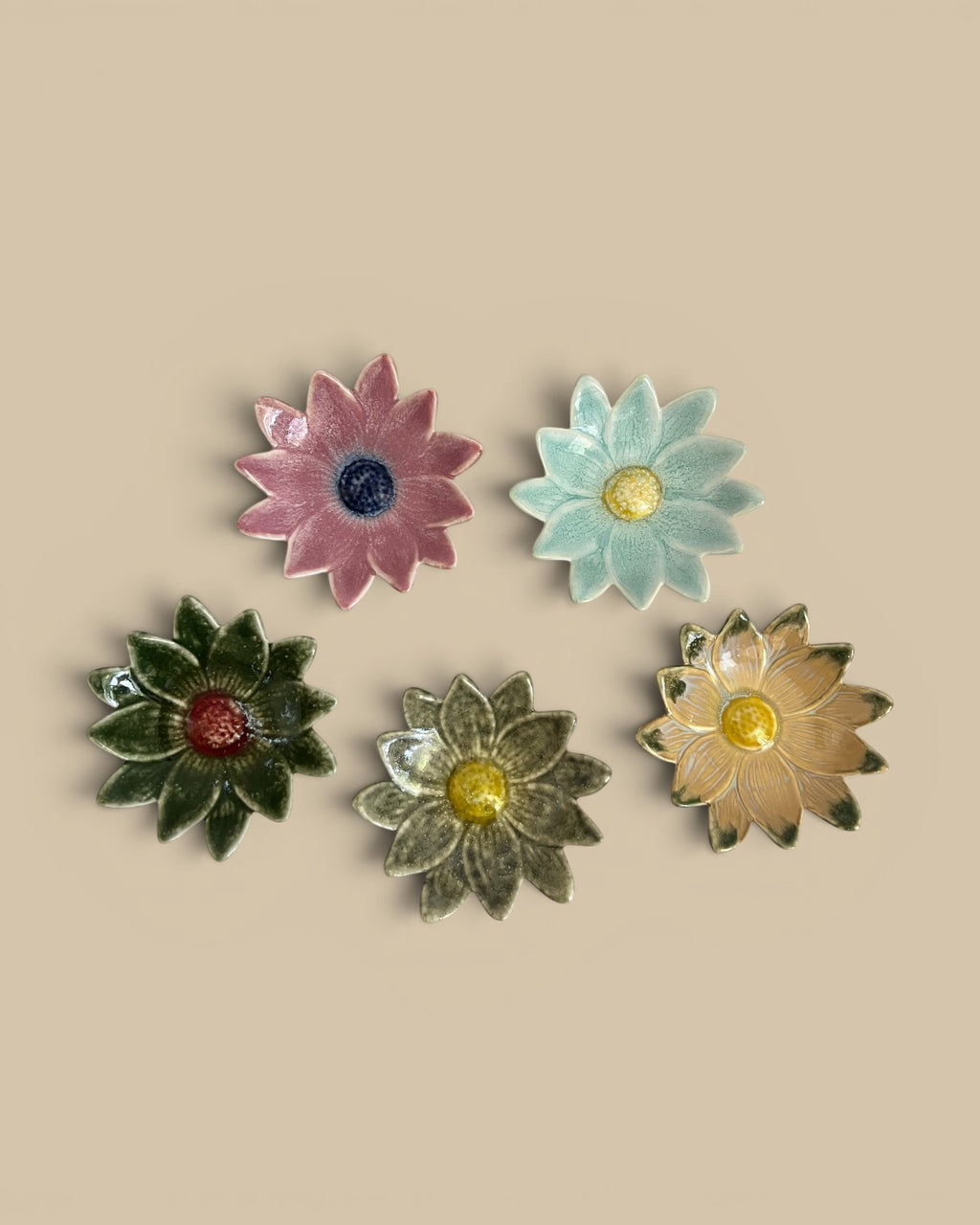 Homestyle Collective Petal Pop stoneware dishes in flower shapes. Available in pink, blue, green, grey, and yellow.