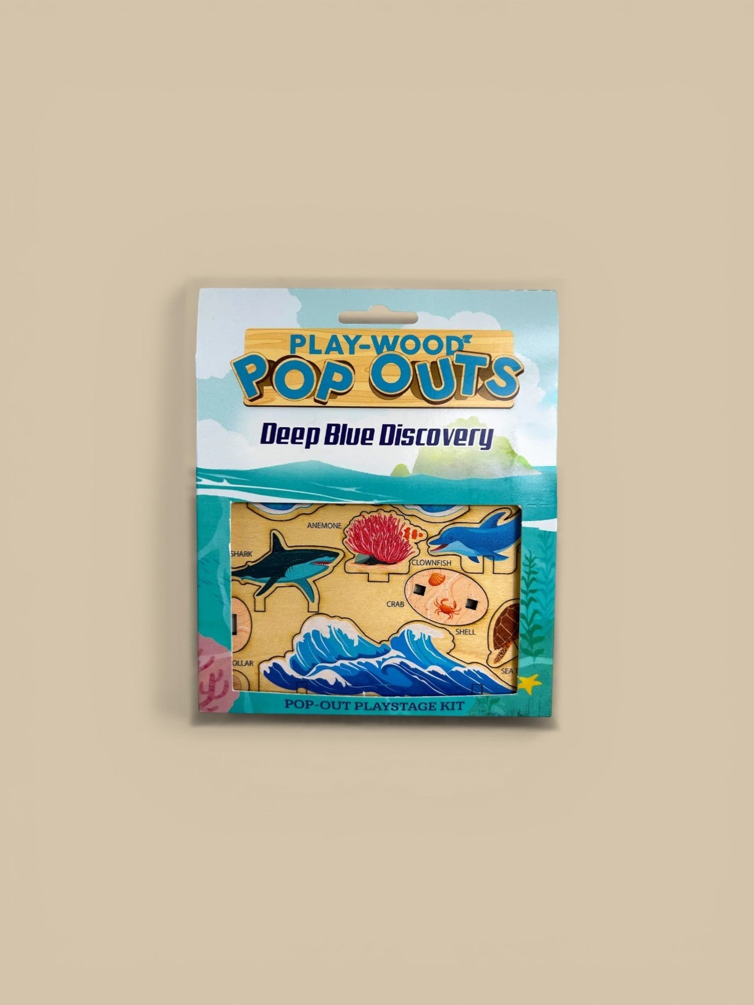 Homestyle Collective Play-Wood Pop-Outs Deep Blue Discovery kit with maple laminate pieces of sharks, dolphins, anemones, crabs, and waves.