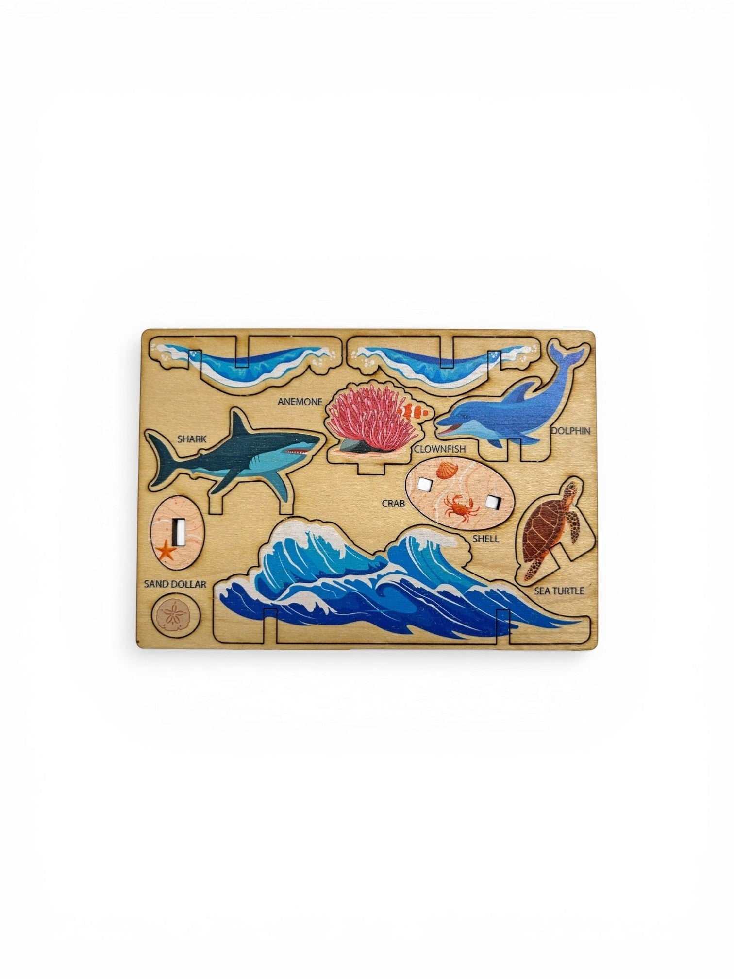 Homestyle Collective Play-Wood Pop-Outs: wooden ocean scene with shark, dolphin, sea turtle, anemone, clownfish, crab, sand dollar, and waves.