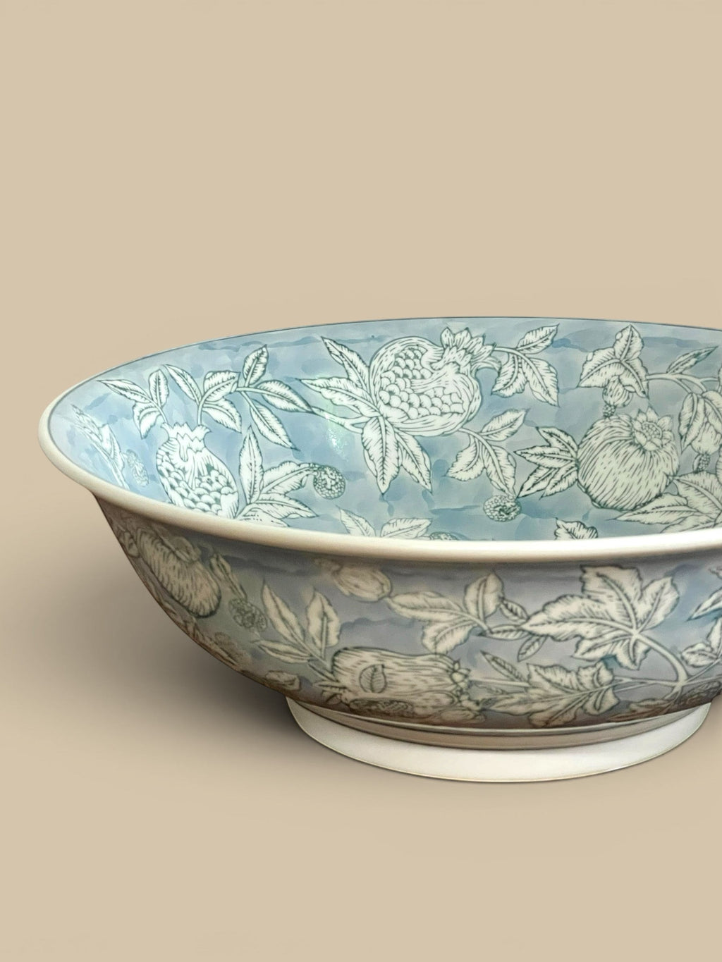 Homestyle Collective Pomegranate Sketch Decorative Bowl in ethereal blue porcelain with hand-painted botanical motifs.