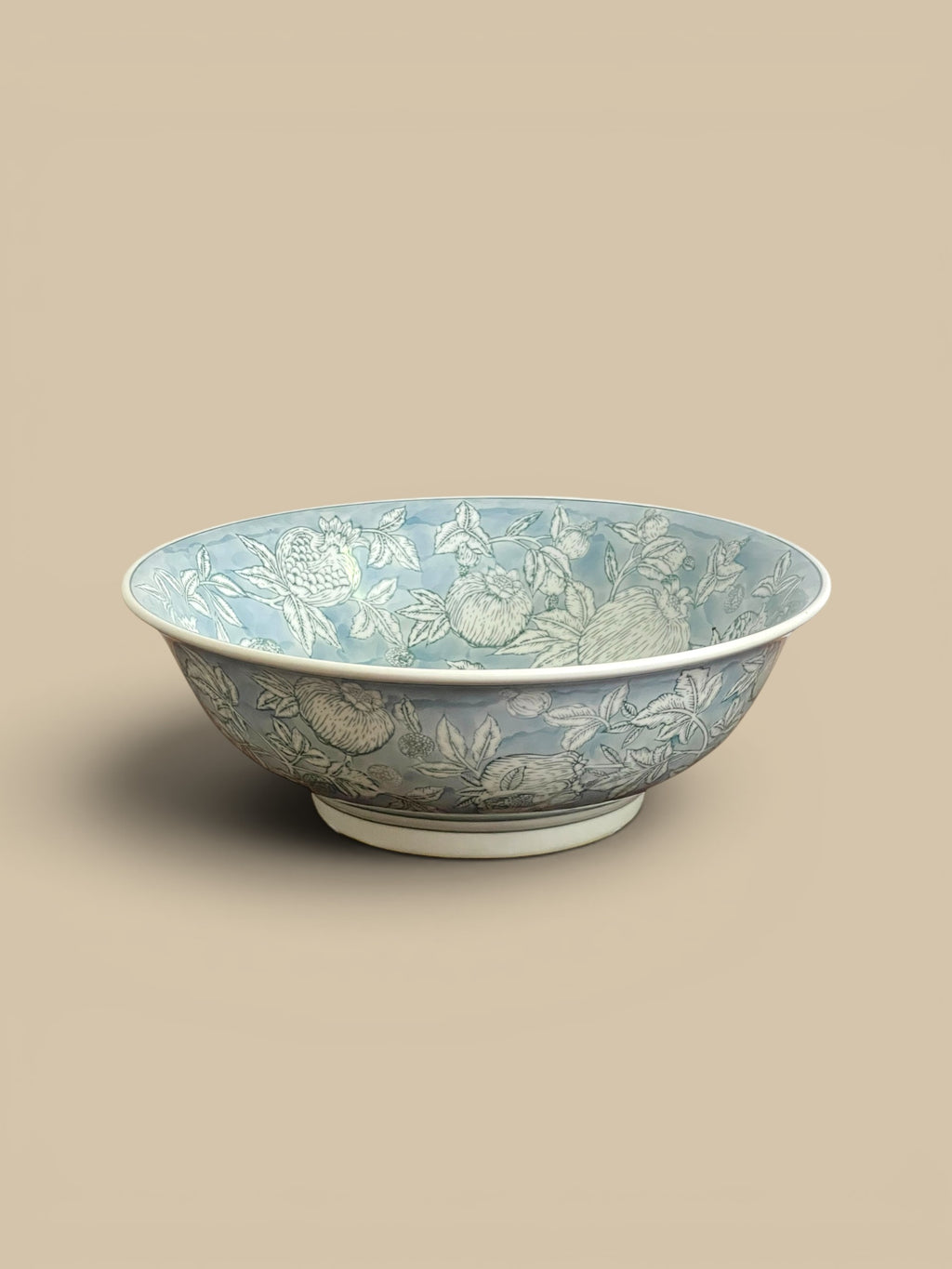 Homestyle Collective Pomegranate Sketch Decorative Bowl, hand-painted porcelain with ethereal blue tones and a gestural pomegranate motif.