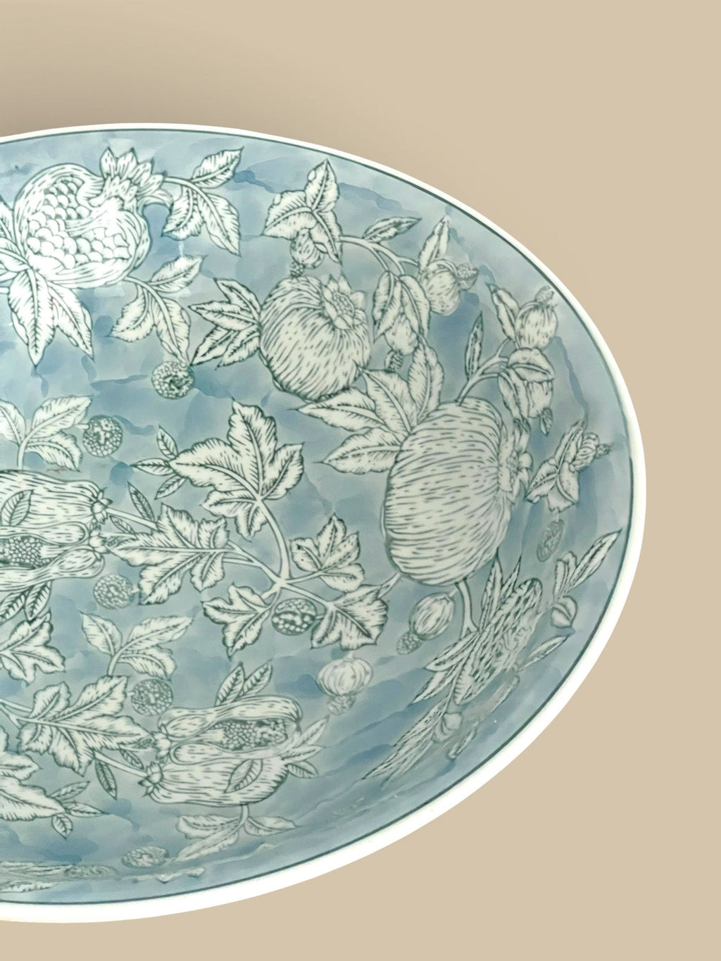 Homestyle Collective Pomegranate Sketch Decorative Bowl in ethereal blue porcelain with hand-painted botanical sketch design.