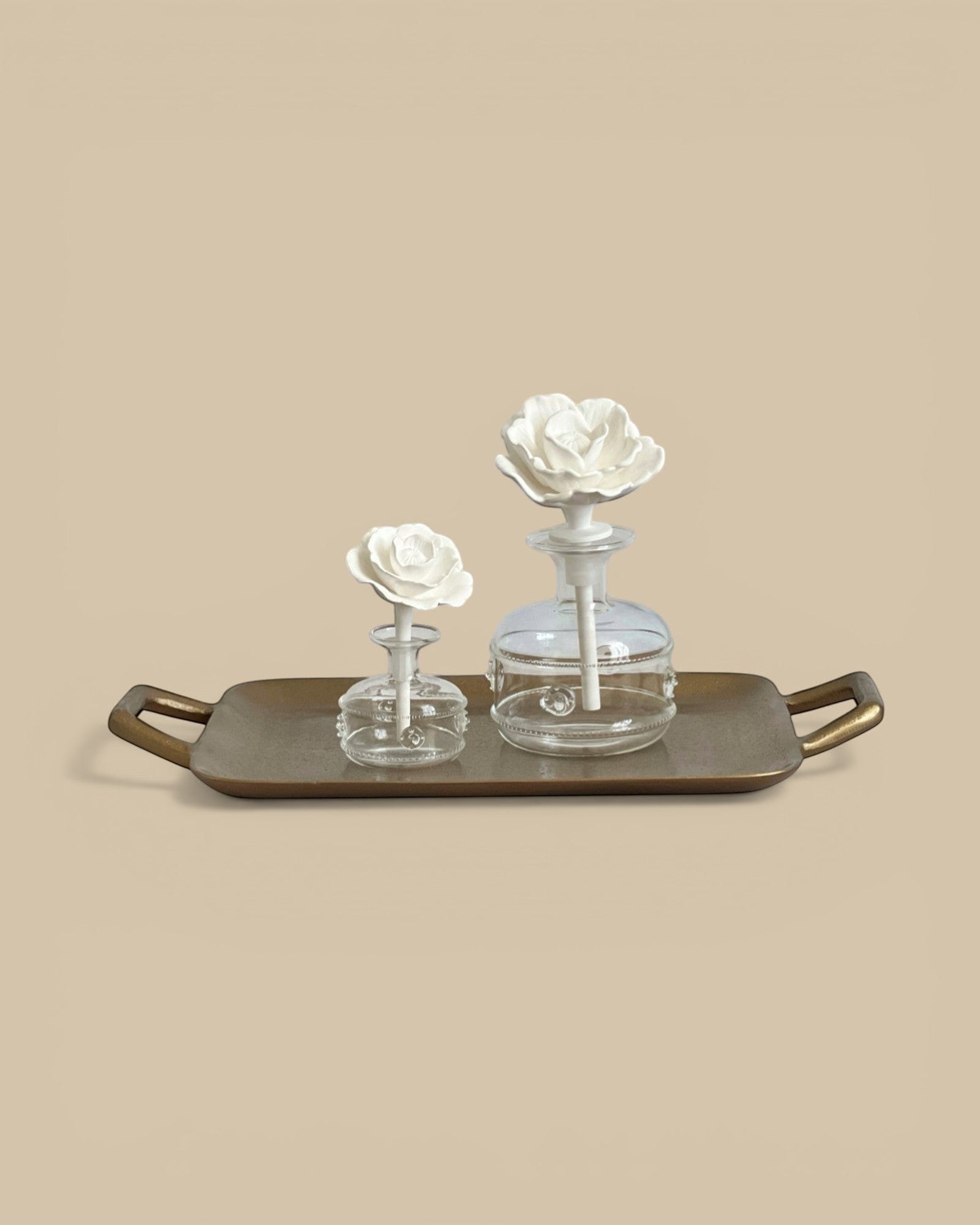 Homestyle Collective Grand Casablanca Porcelain Diffuser with white floral top in Tahitian Gardenia scent.