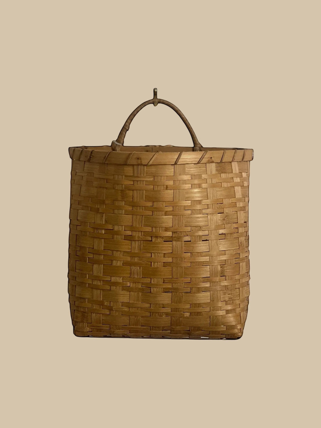 Homestyle Collective natural rattan hanging basket with handle, flat back, woven texture. Set of 2.