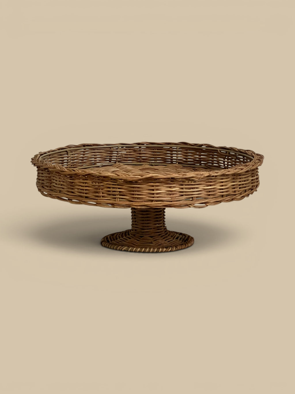 Homestyle Collective natural woven rattan pedestal with braided rim, 14" round x 5.5" H.