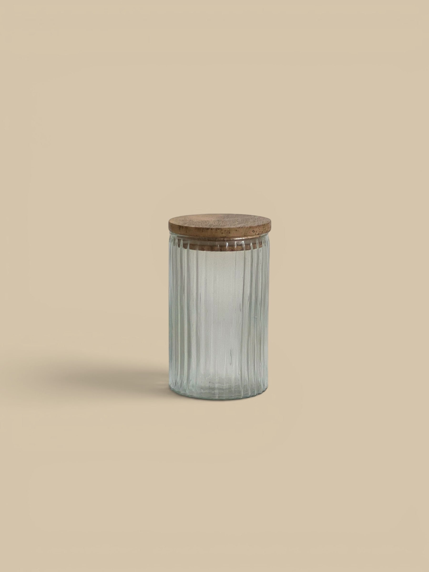 Homestyle Collective Clara ribbed glass canisters with wooden lids, available in two sizes for pantry or bath storage.