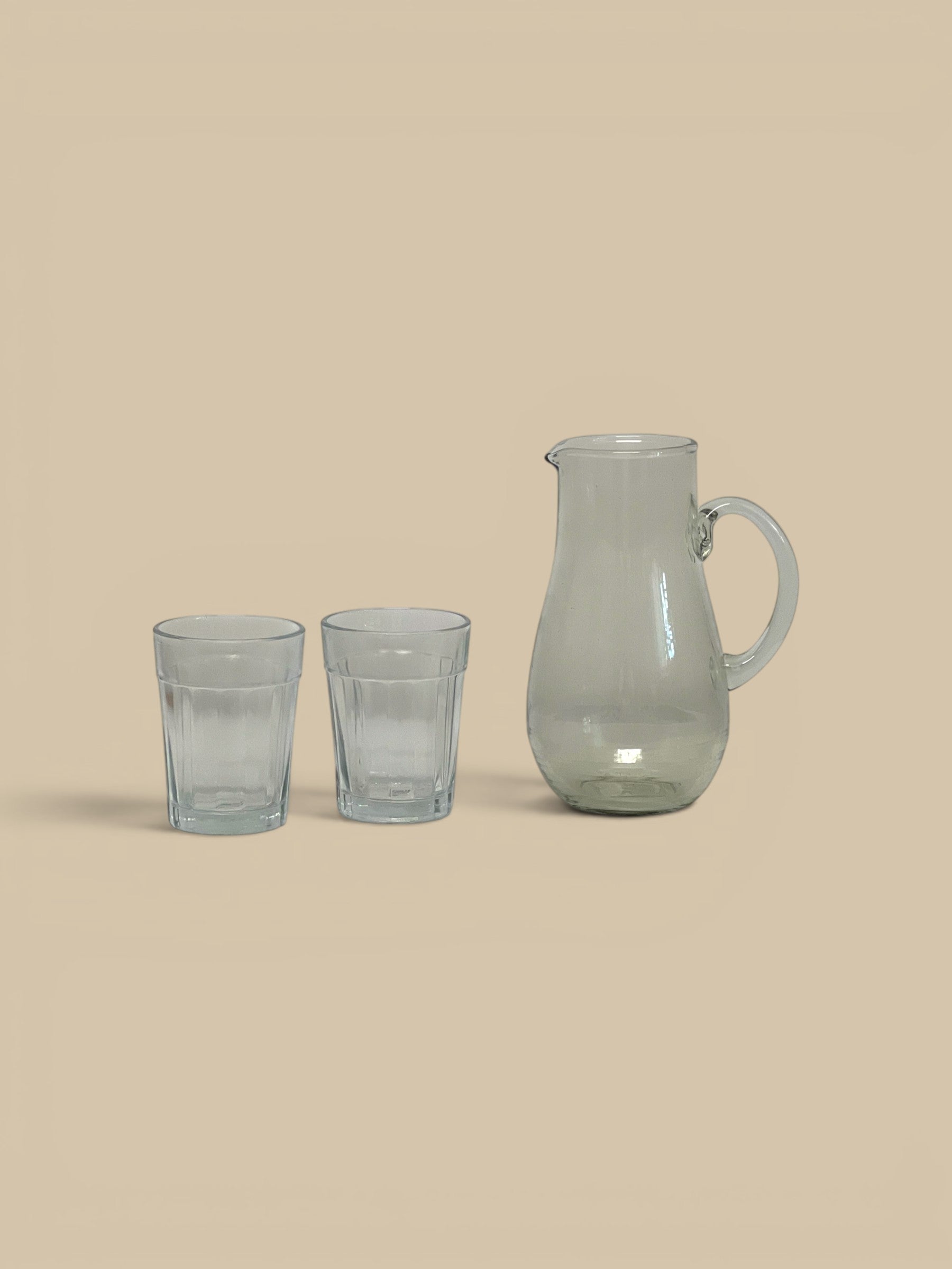 Homestyle Collective Minette ribbed glass pitcher and two tumblers, clear glass with fluted texture.