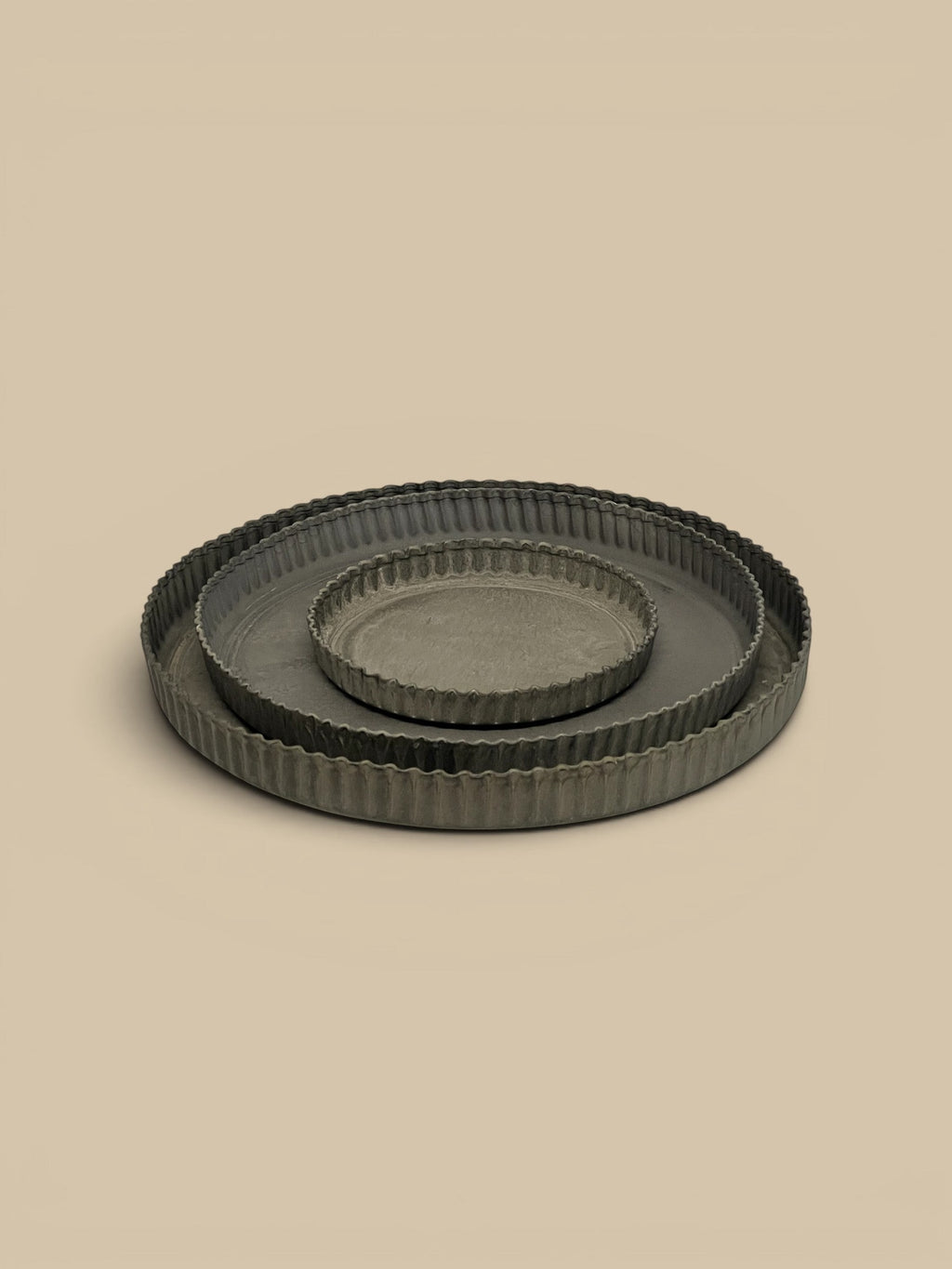Homestyle Collective Ross Tray set of 3 dark grey metal tart dishes with crimped edges for styling.
